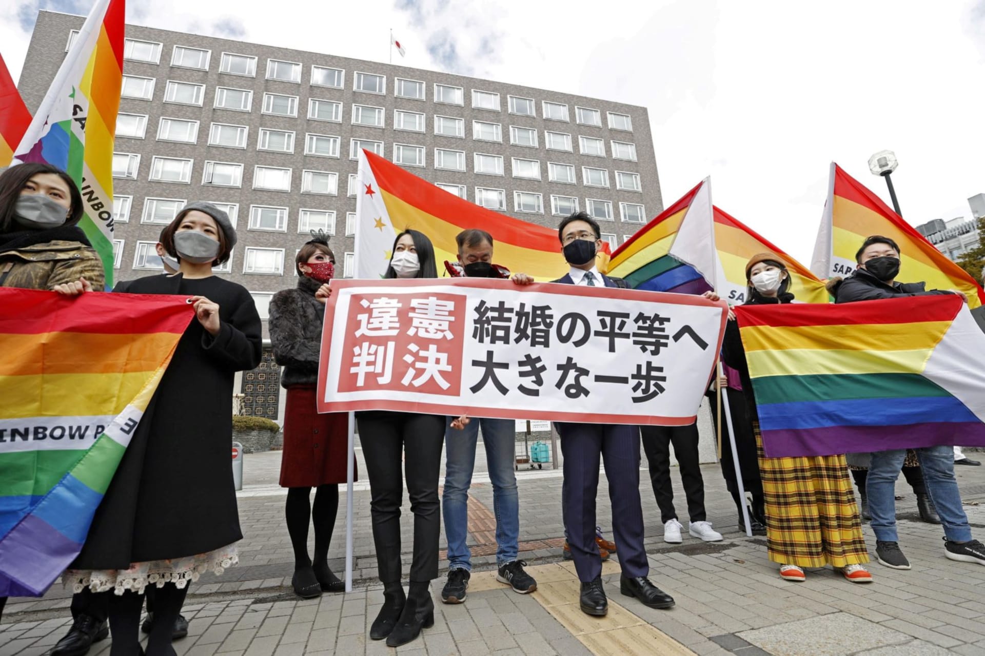 <p>Plaintiffs’ lawyers and supporters show a banner stating the ruling found the government measures unconstitutional, after a district court ruled on the legality of same-sex marriages outside Sapporo District Court in Sapporo, Hokkaido, March 17, 2021</p>
