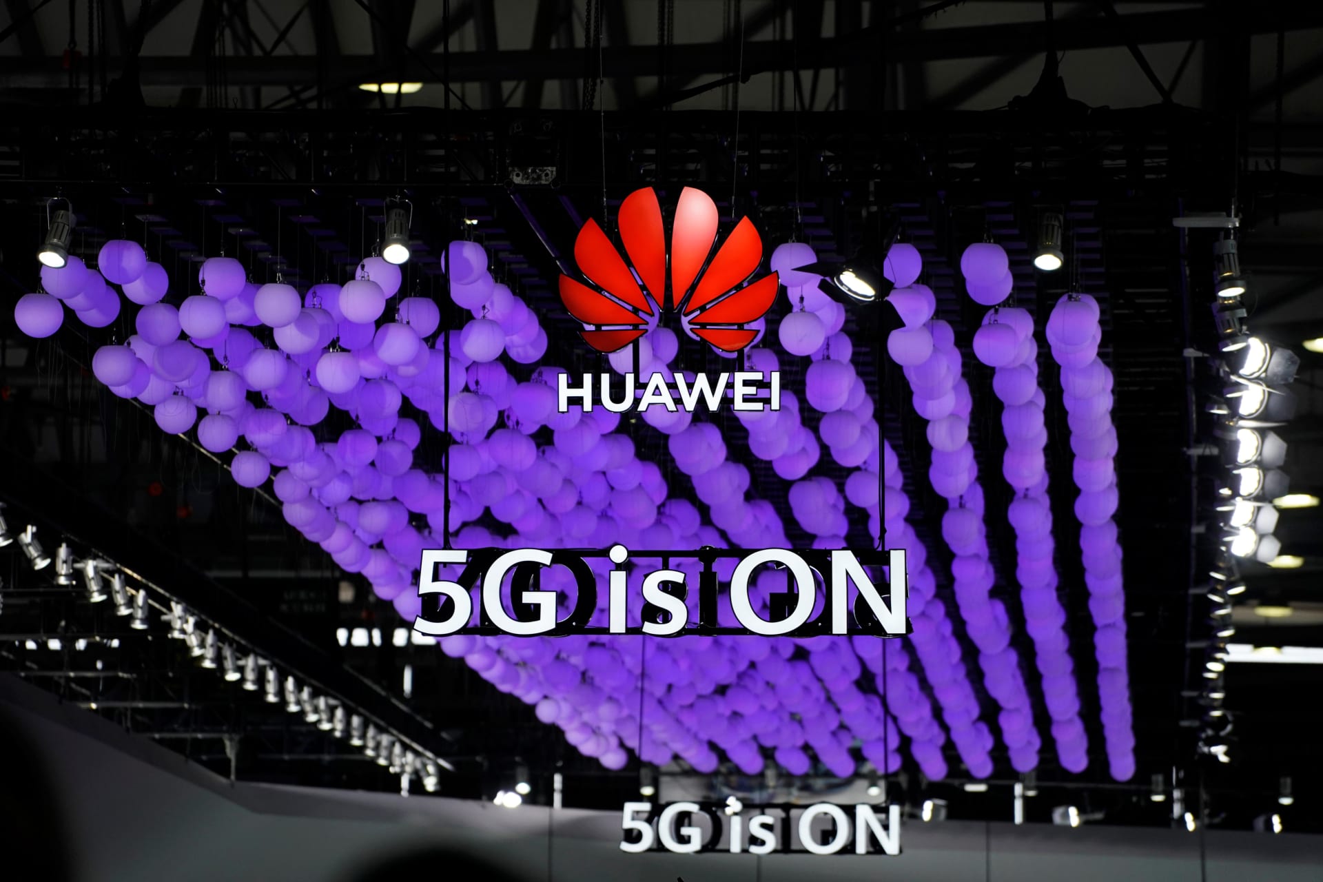 <p>A Huawei logo and a 5G sign are pictured at Mobile World Congress (MWC) in Shanghai.</p>
