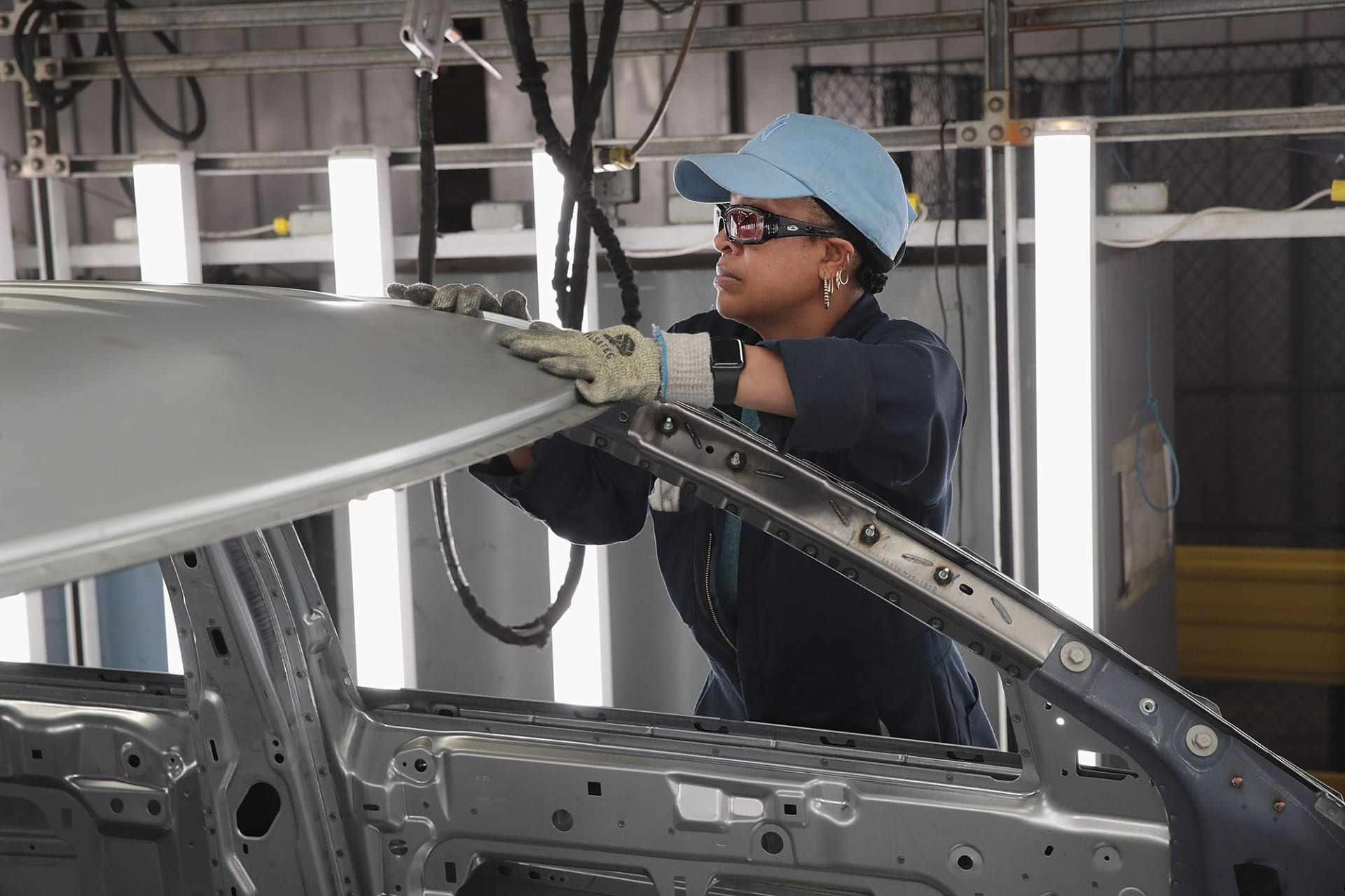 <p>Workers assemble Ford vehicles at a plant in Chicago, Illinois.</p>
