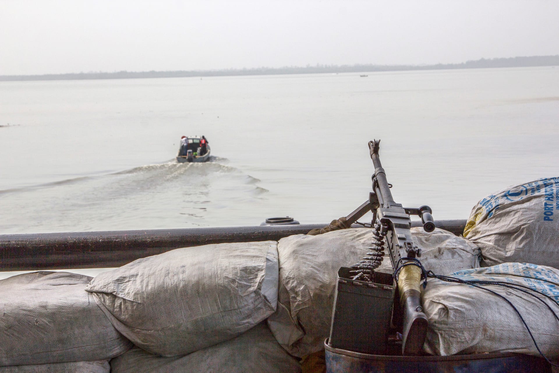 <p>A machine gun is seen on a sandbag on a boat off the Atlantic coast in Nigeria’s Bayelsa State on December 19, 2013.</p>
