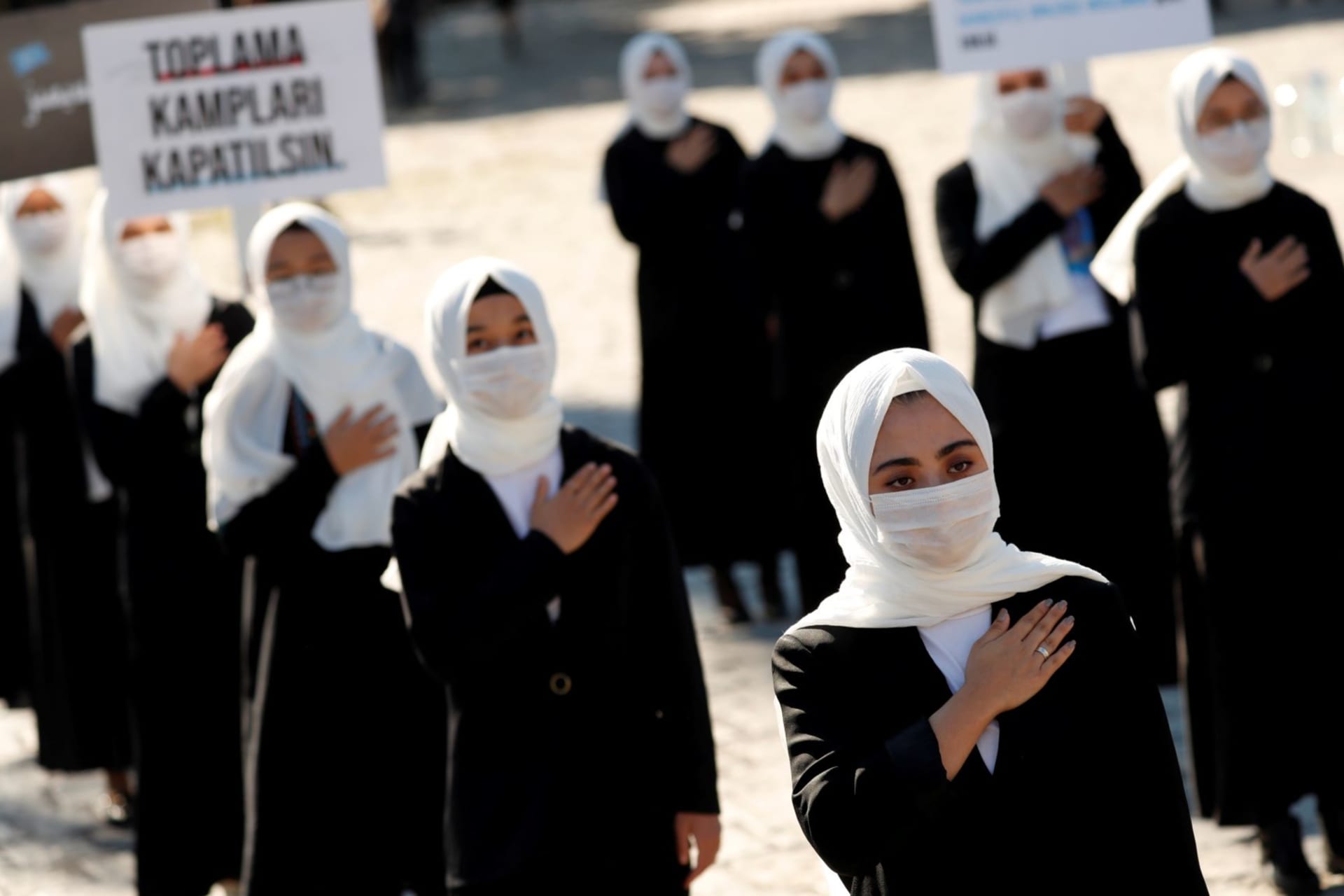 <p>Uighur women participate in a protest against the Chinese government in Istanbul, Turkey.</p>
