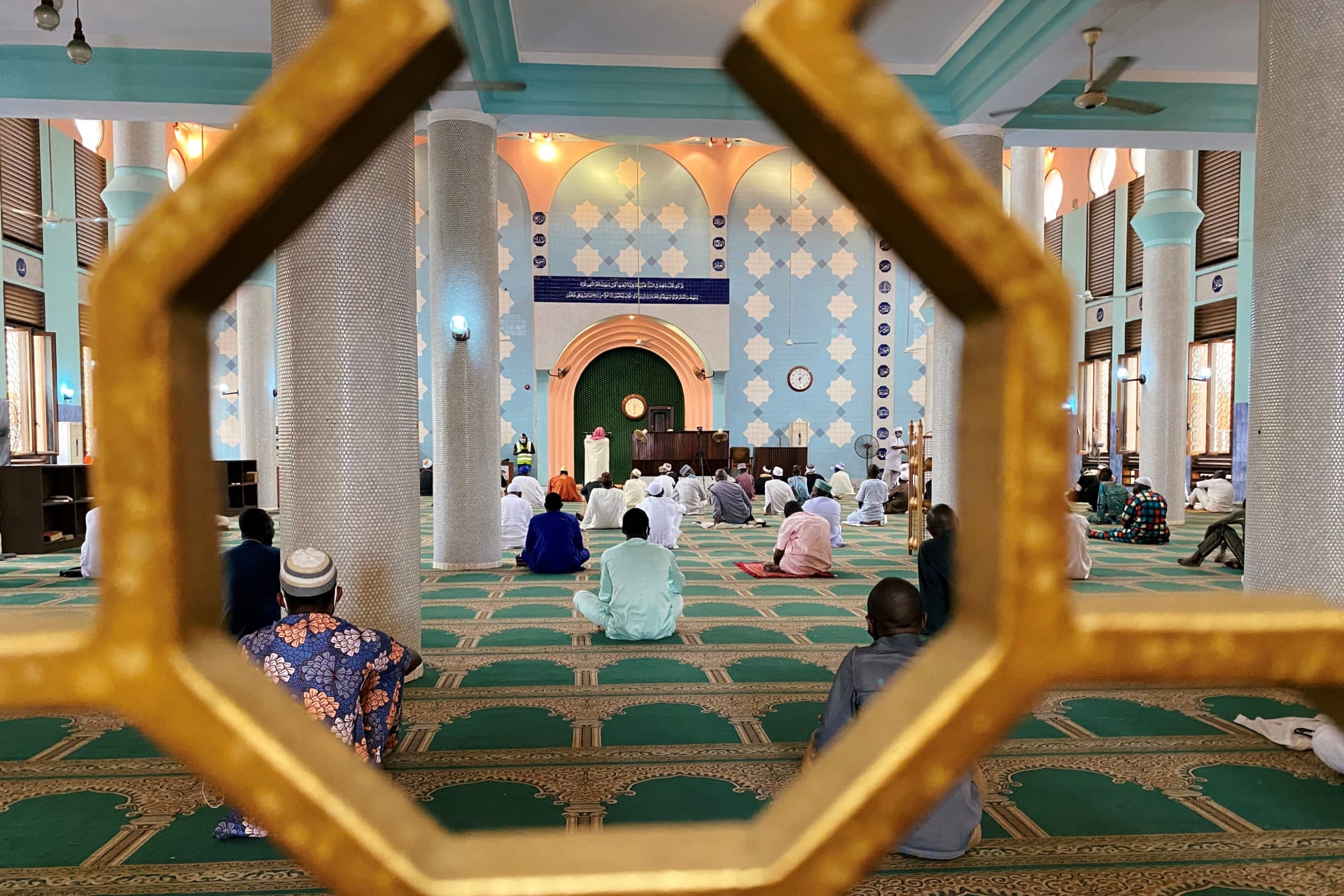 <p>Muslim worshippers attend Friday prayers inside a mosque, after houses of worship reopened in Nigeria’s commercial capital Lagos, amid concerns over the spread of the coronavirus disease (COVID-19), in Lagos, Nigeria on August 7, 2020.</p>
