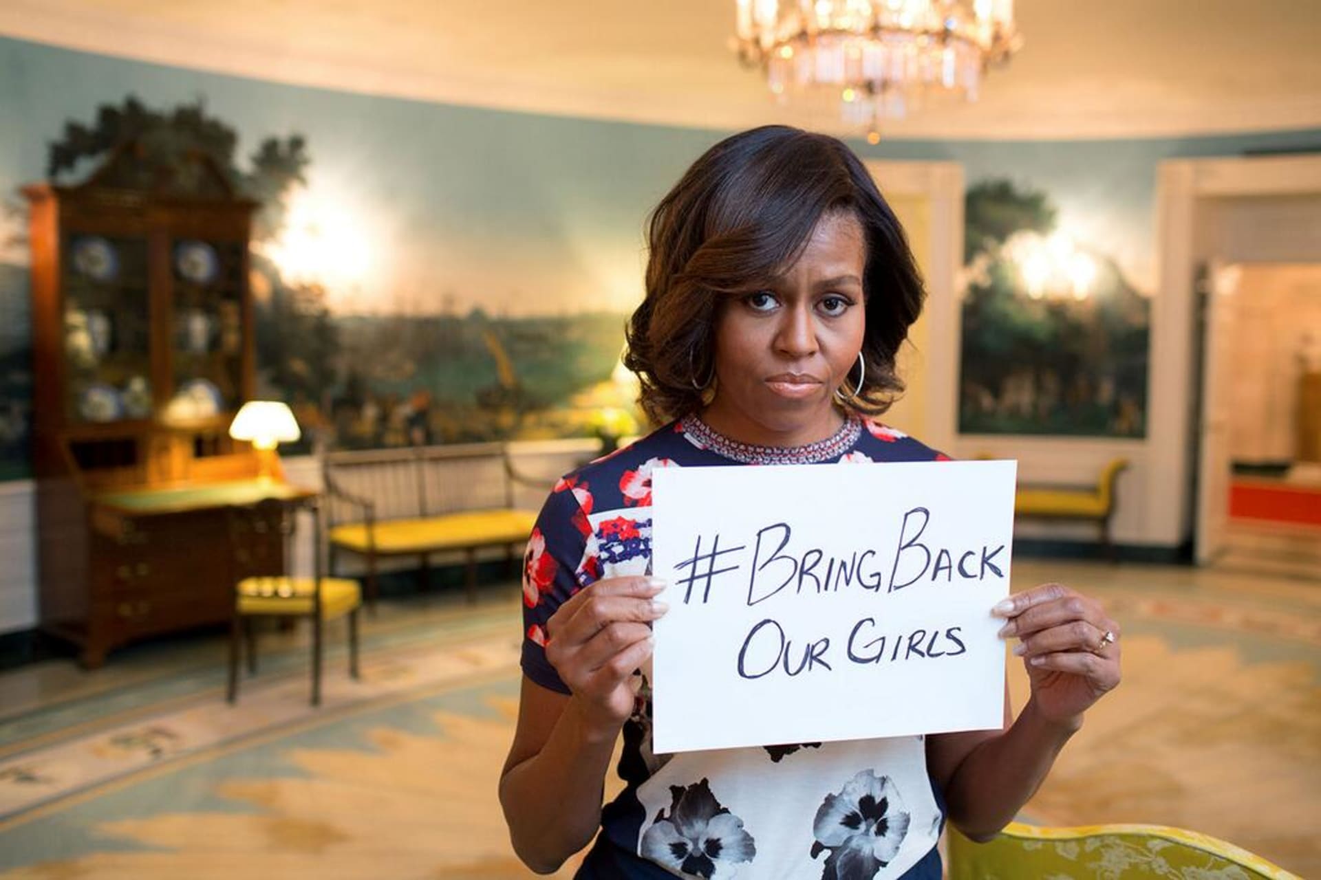 <p>First Lady Michelle Obama holding a sign with the hashtag “#BringBackOurGirls” in response to the 2014 Chibok kidnapping in Borno State, Nigeria. Posted to the FLOTUS Twitter account on May 7, 2014.</p>
