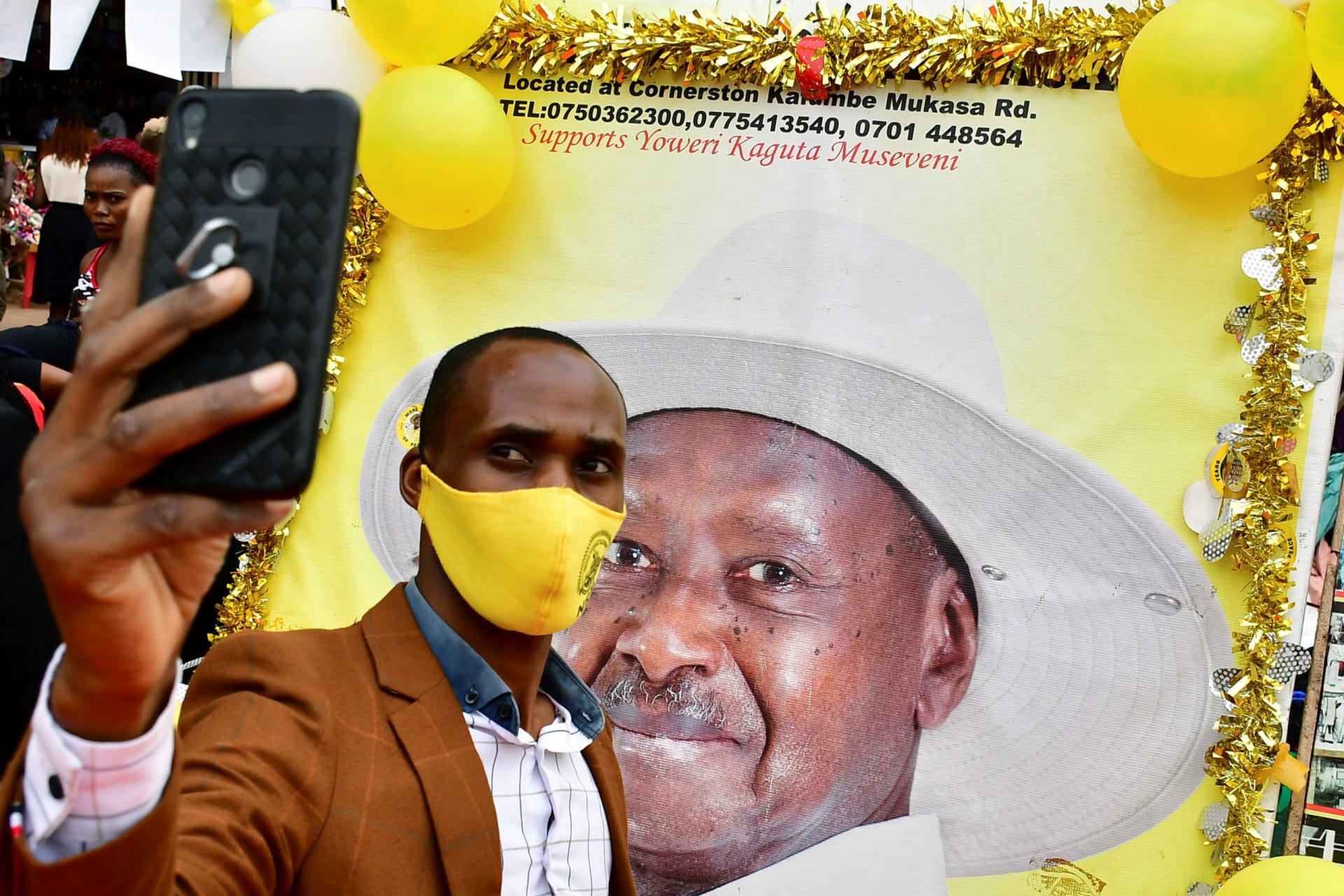 <p>A supporter of Uganda’s President Yoweri Museveni takes a selfie.</p>
