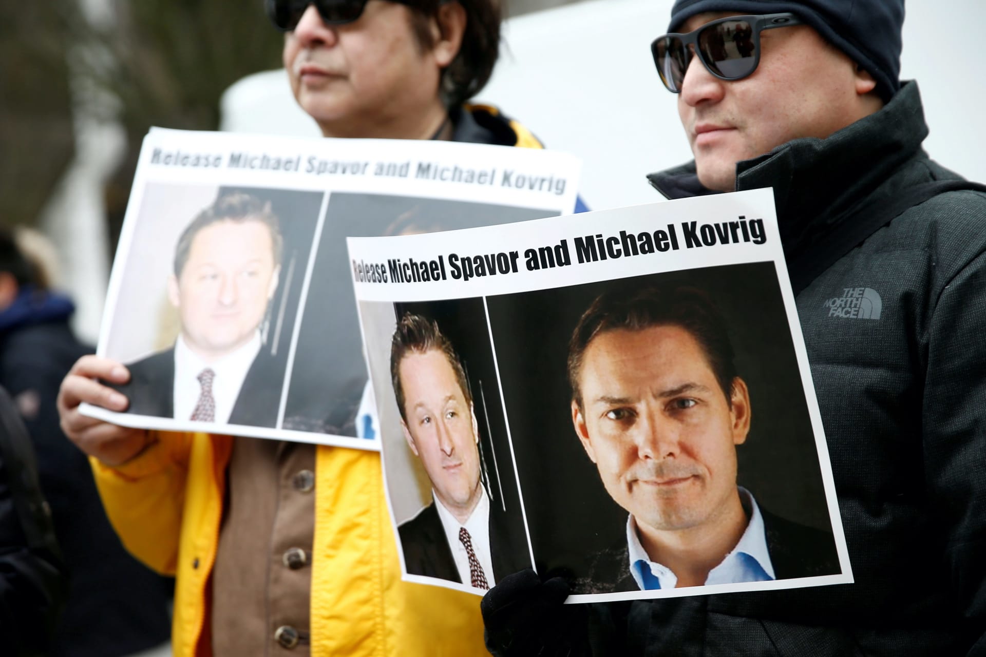 <p>People hold signs calling for China to release Canadian detainees Michael Spavor and Michael Kovrig, in Vancouver, Canada on March 6, 2019.</p>
