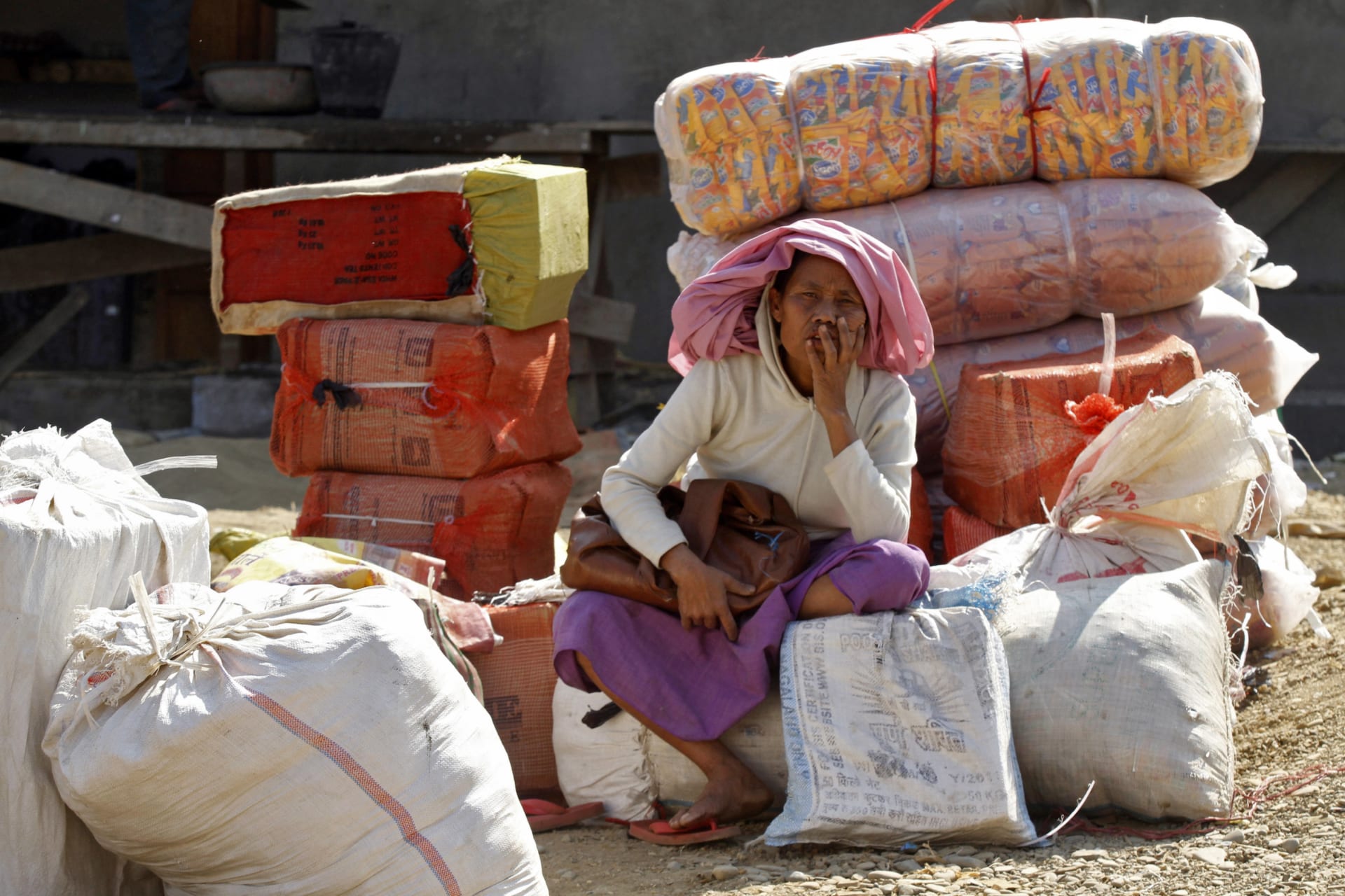 Woman sits in Myanmar. Radik De Chowdhuri/REUTERS