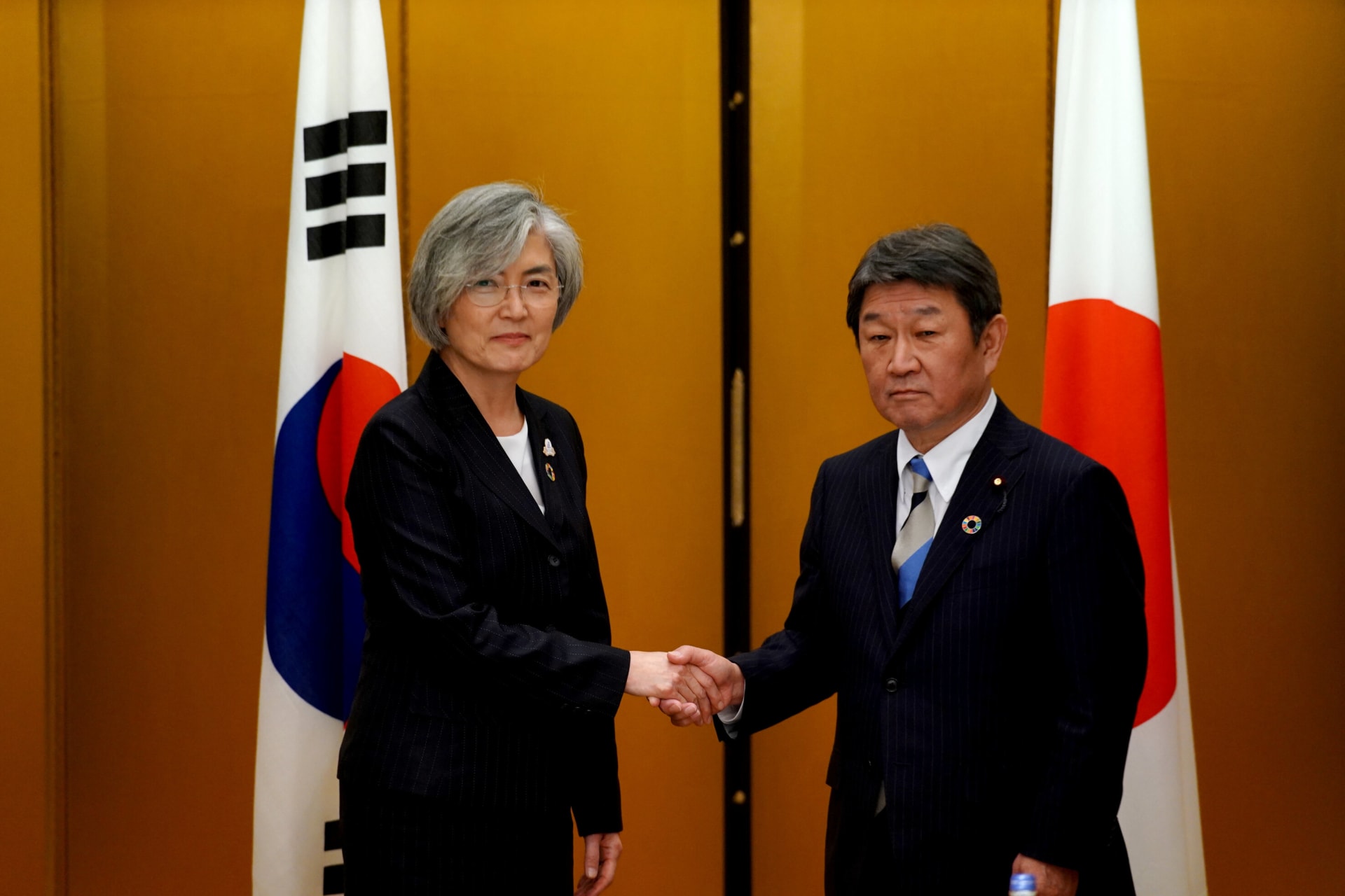 <p>Japan’s Foreign Minister Toshimitsu Motegi shakes hands with South Korea’s Foreign Minister Kang Kyung-wha before the G20 foreign ministers meeting in Nagoya, Japan, on November 23, 2019. </p>
