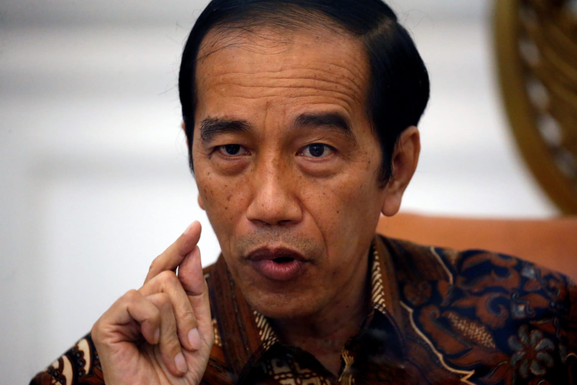 <p>Indonesian President Joko Widodo gestures during an interview with Reuters at the presidential palace in Jakarta, Indonesia, November 13, 2020.</p>

