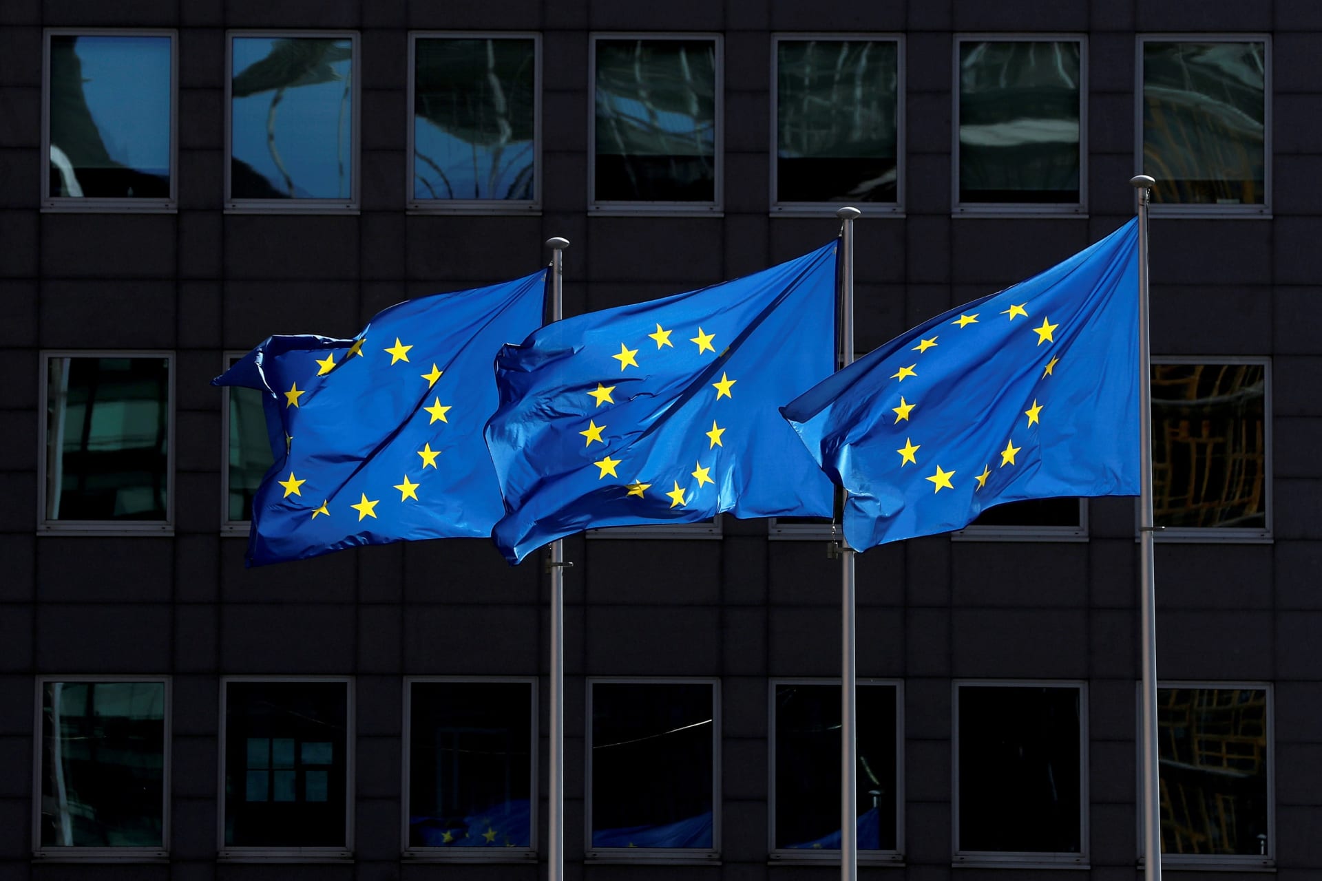 <p>European Union flags flutter outside the European Commission headquarters in Brussels.</p>
