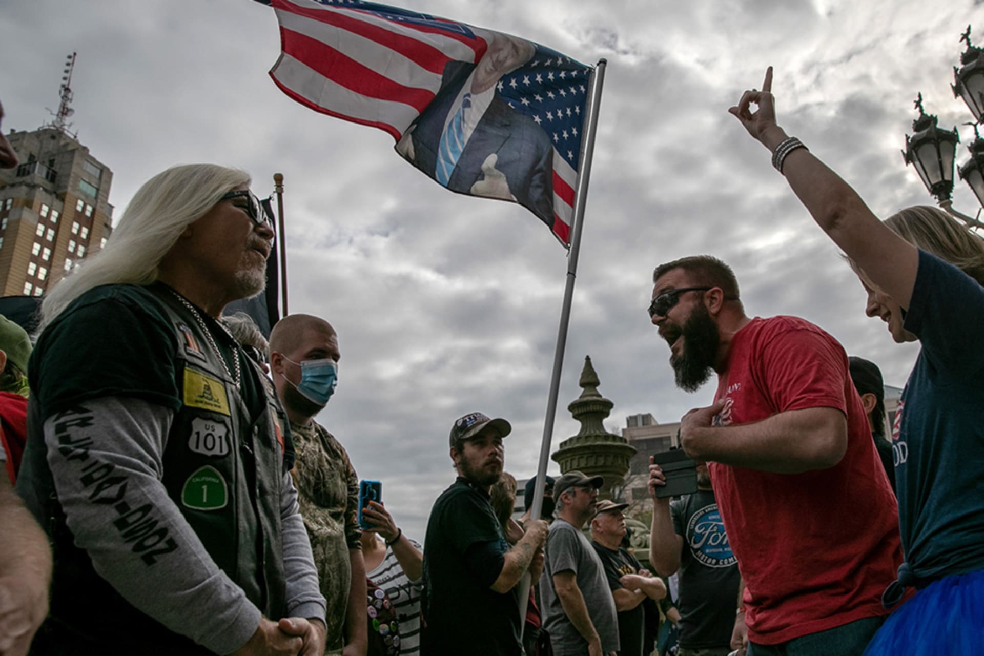 <p>Pro-Trump (R) and anti-Trump demonstrators argue at the Michigan state capitol on November 08, 2020 in Lansing, Michigan.</p>
