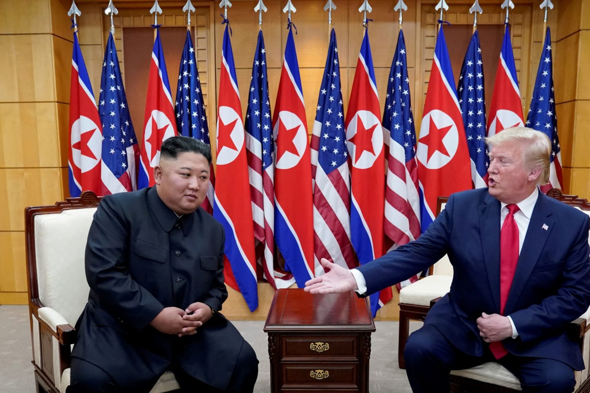 <p>U.S. President Donald J. Trump meets with North Korean leader Kim Jong Un at the demilitarized zone separating the two Koreas, in Panmunjom, South Korea on June 30, 2019. </p>
