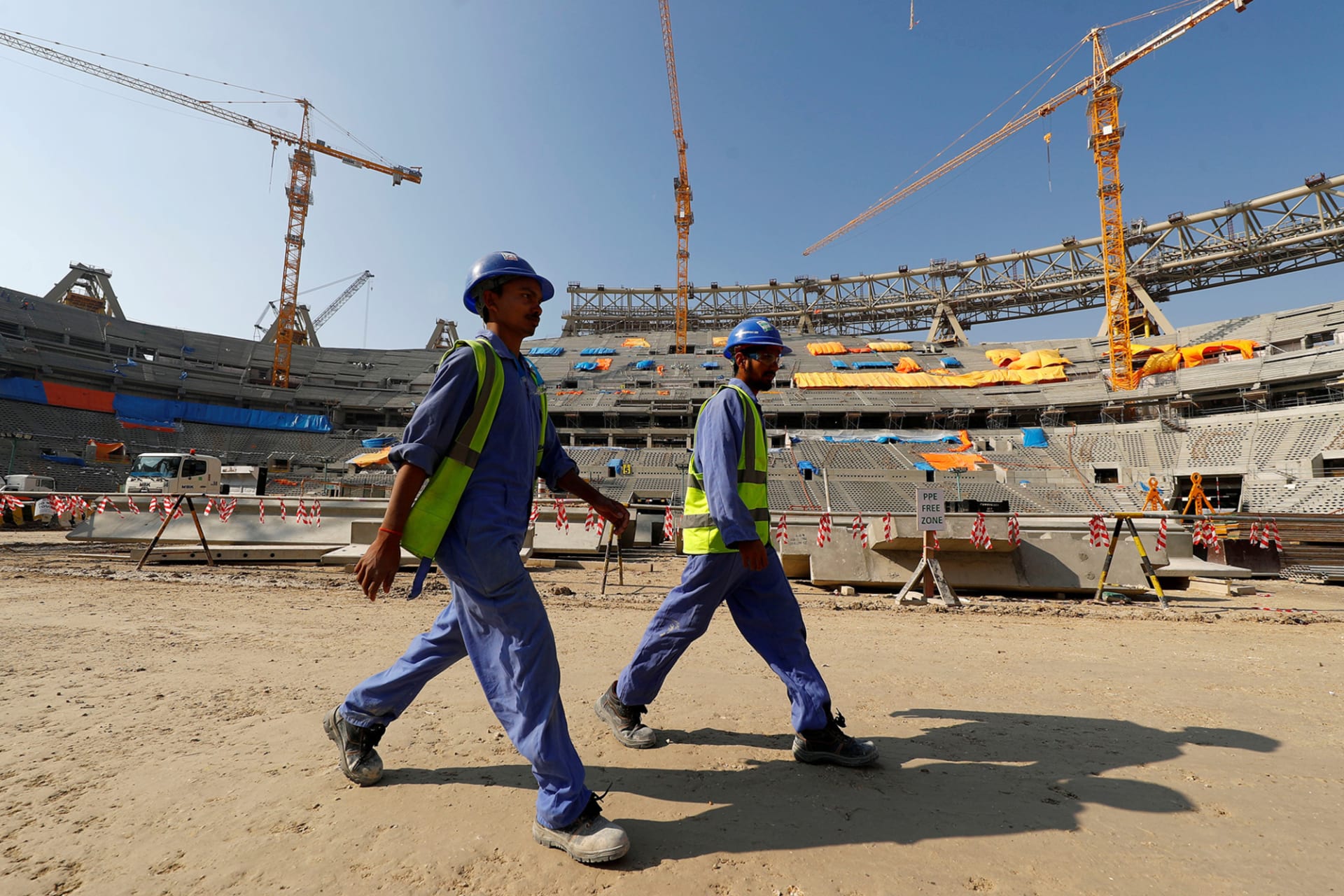 <p>Workers construct the Lusail National Stadium for the 2022 FIFA World Cup in Doha, Qatar.</p>
