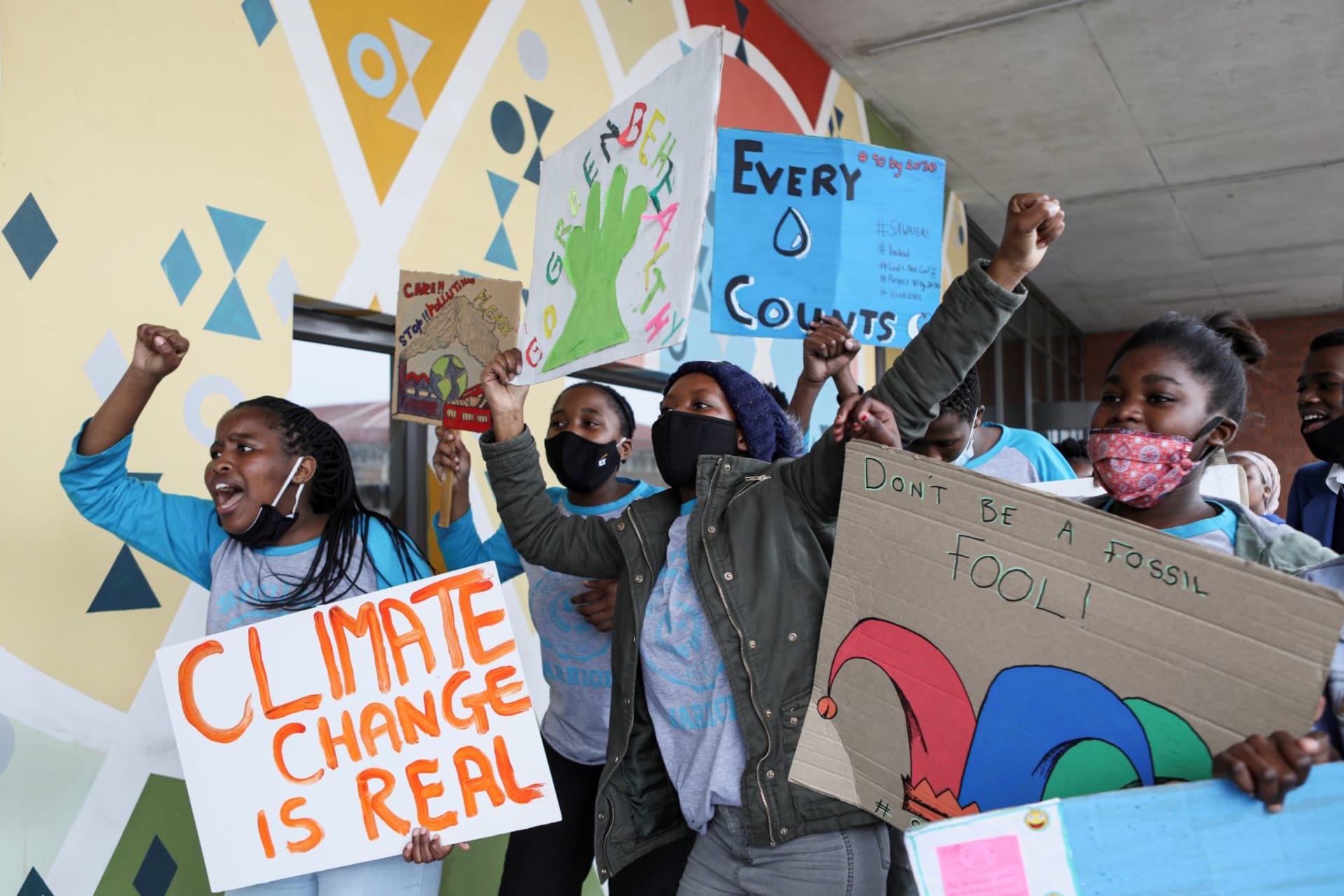 <p>Young activists gesture as they take part in a demonstration during a global day of action on climate change near Cape Town, South Africa on September 25, 2020. </p>
