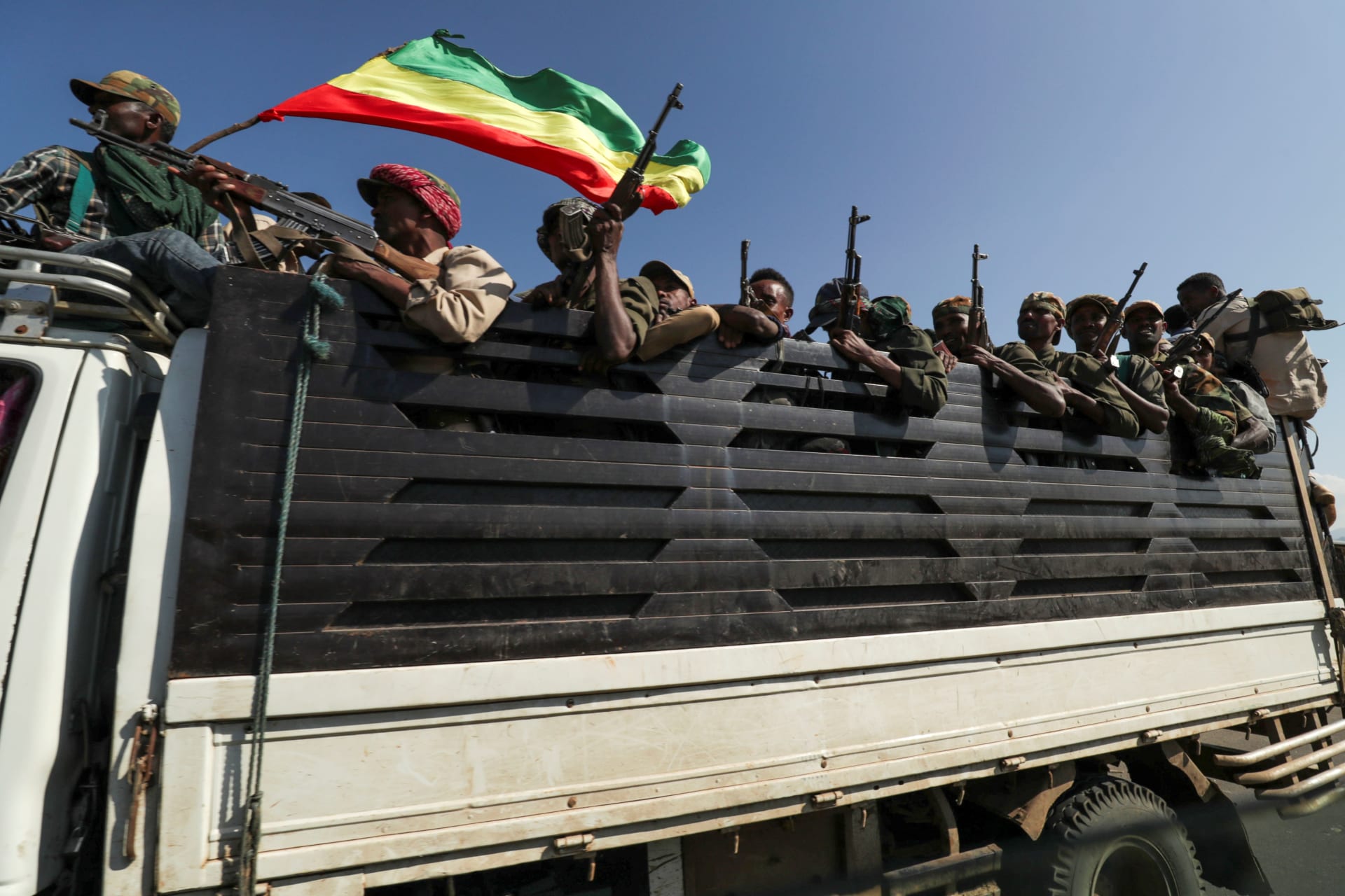 <p>Members of Amhara region militias ride on their truck as they head to face the Tigray People’s Liberation Front (TPLF), in Sanja, Amhara region near a border with Tigray, Ethiopia November 9, 2020</p>
