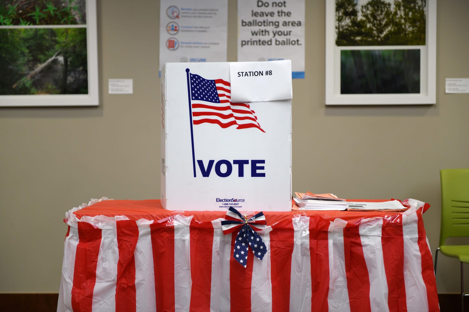 <p>A voting booth is prepared.</p>
