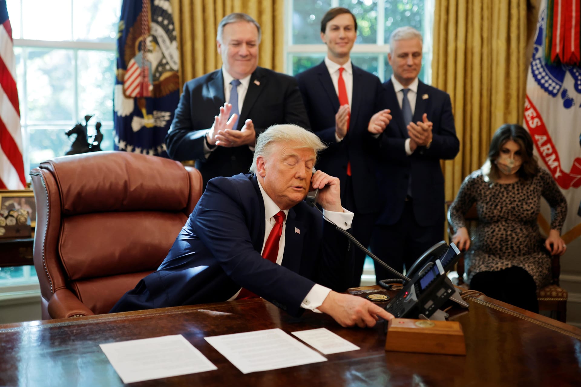 <p>U.S. President Donald Trump speaks on the phone with leaders of Israel and Sudan about the decision to rescind Sudan’s designation as a state sponsor of terrorism, in the Oval Office at the White House in Washington, U.S., October 23, 2020</p>
