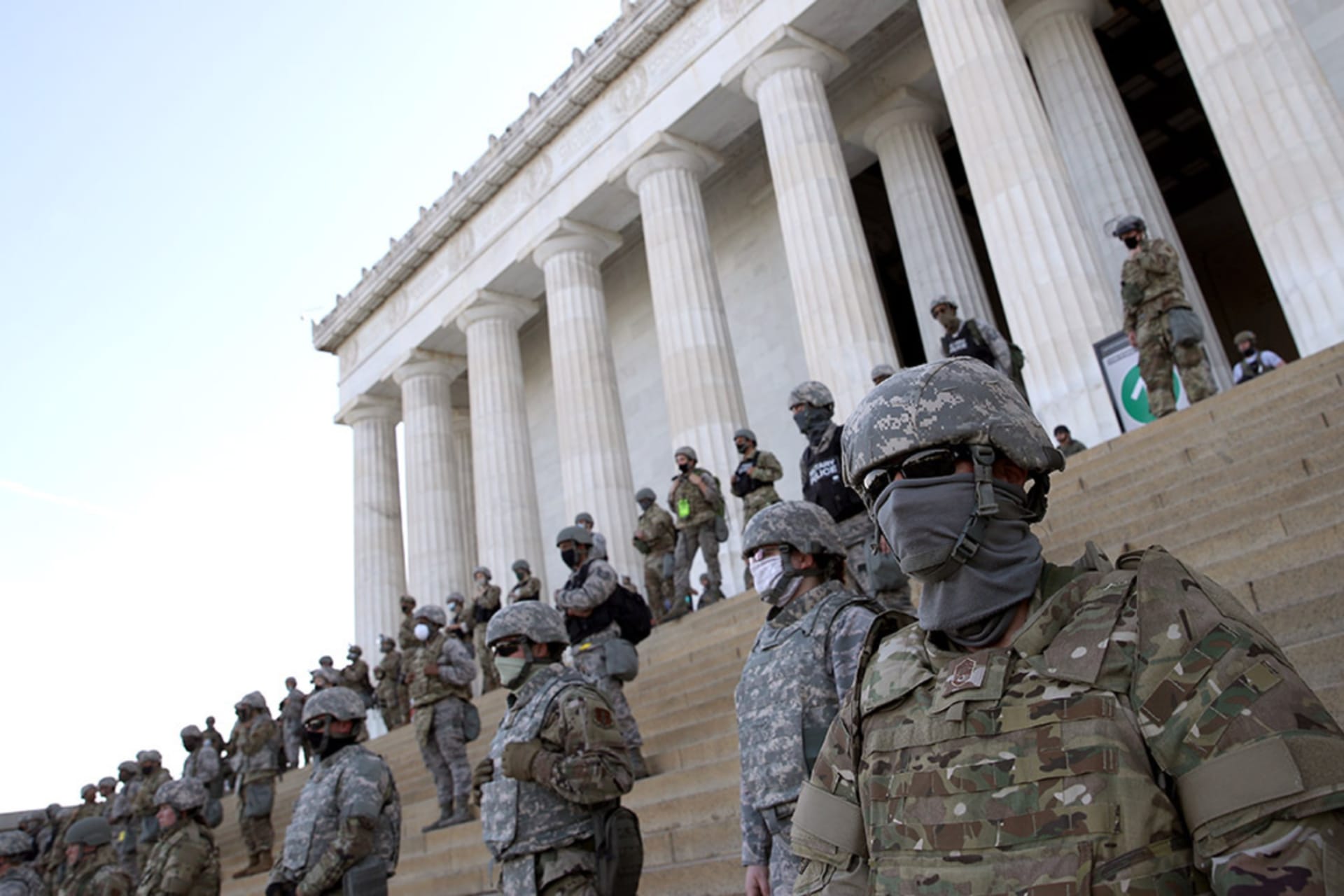 <p>Members of the D.C. National Guard stand on the steps of the Lincoln Memorial.</p>
