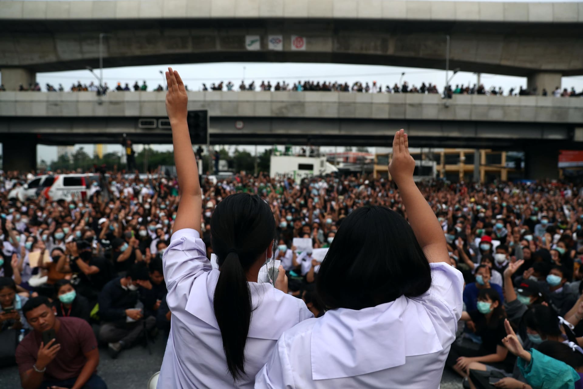 <p>Pro-democracy protesters show the three-finger salute during an anti-government protest, in Bangkok, Thailand on October 19, 2020.</p>
