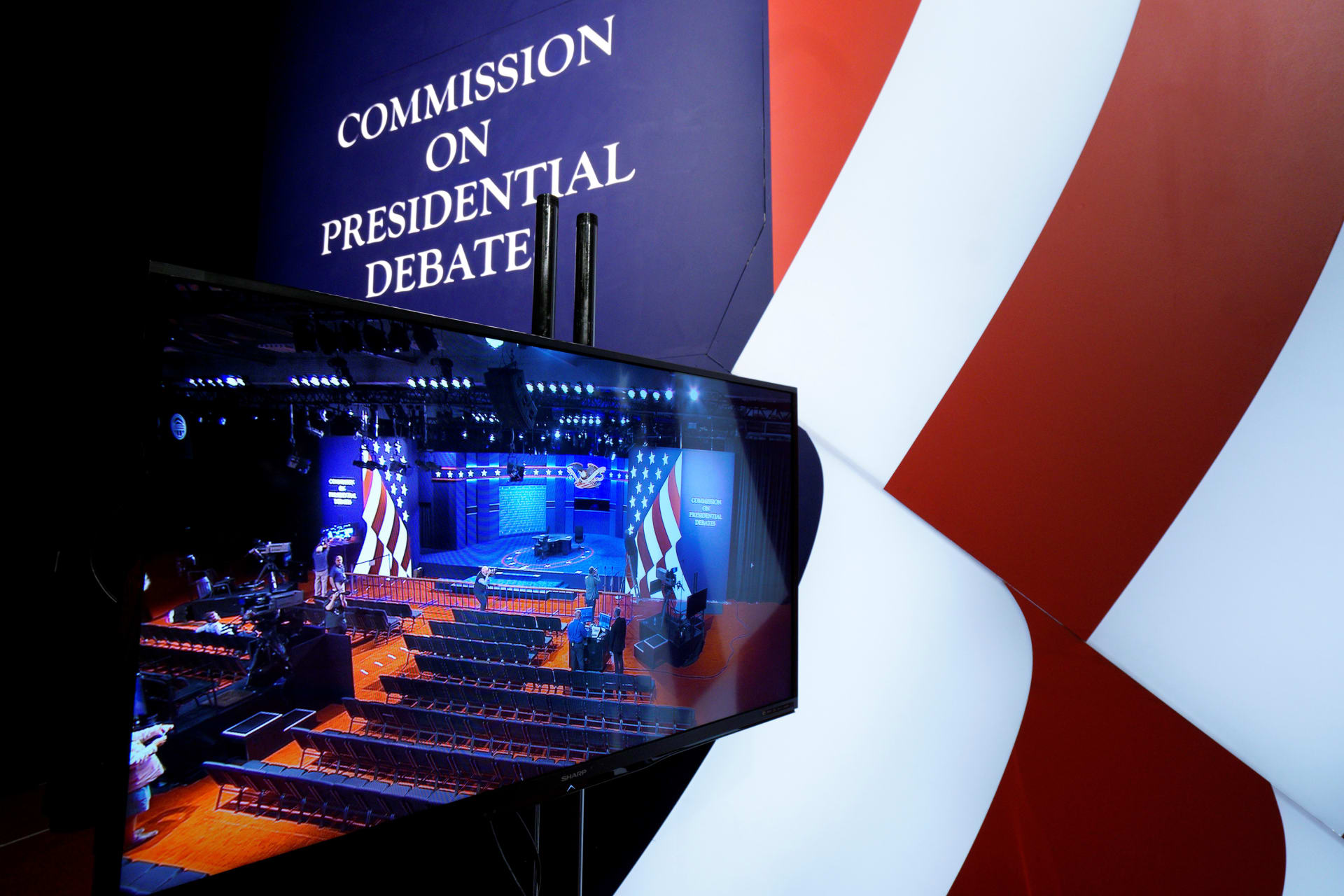 <p>A television monitor shows the stage of the vice-presidential debate in 2016. Rick Wilking/Reuters</p>
