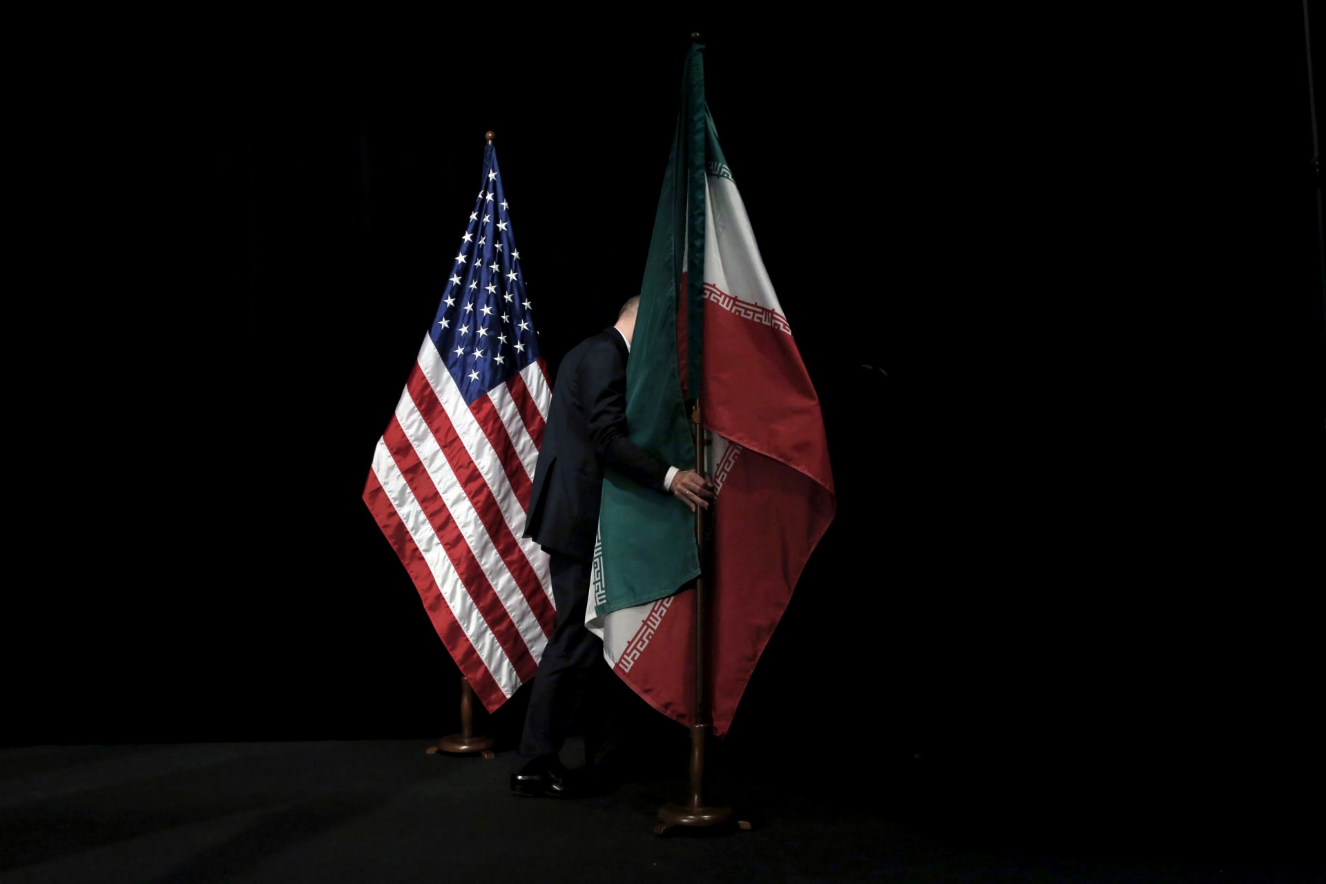 <p>The Iranian flag being removed from a stage during the Iran nuclear deal negotiations in Vienna, Austria, on July 14, 2015. </p>

