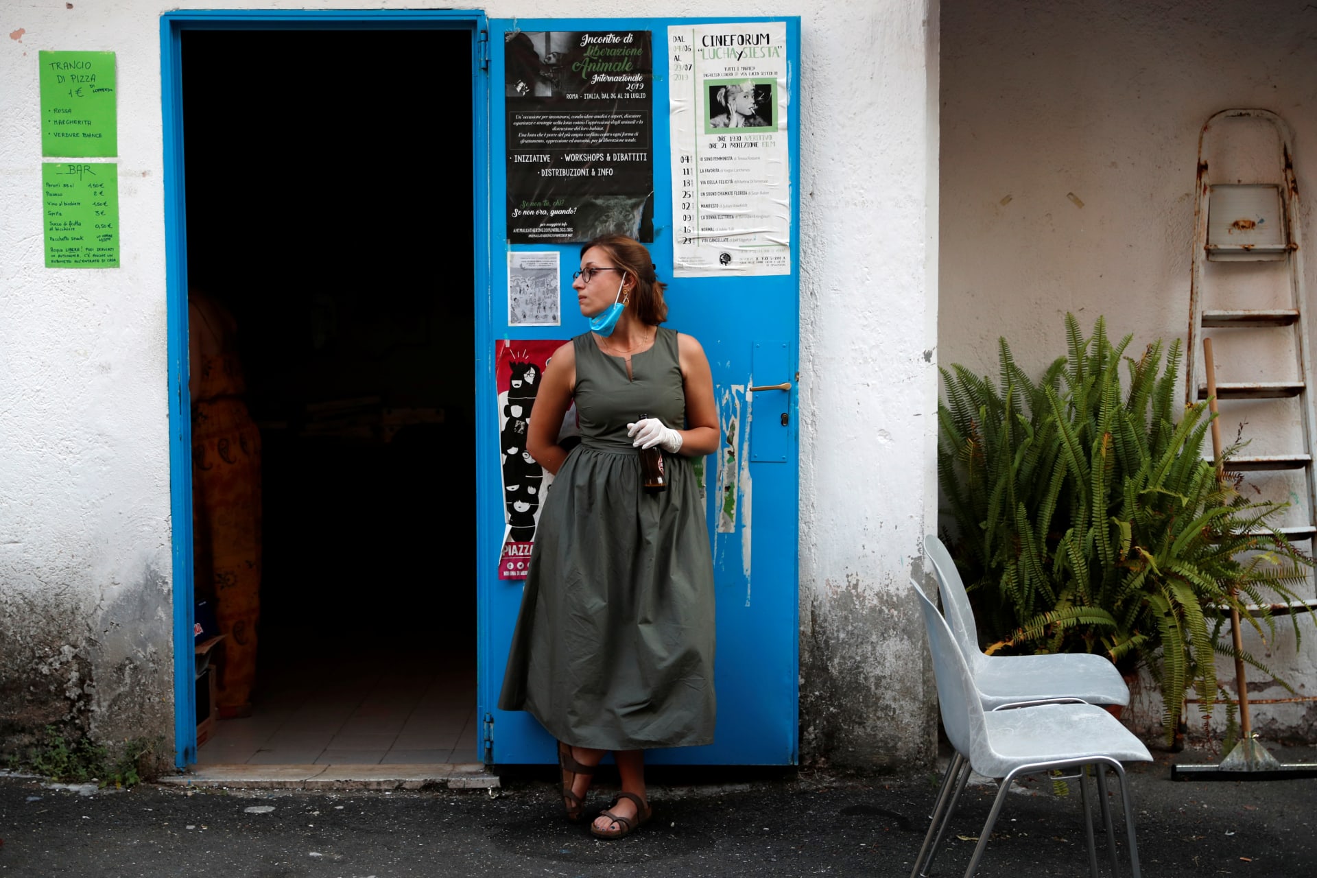 <p>An activist from Lucha y Siesta (Fight and Rest) women’s house, a building run by activists to care for domestic violence survivors, attends a film screening at the house. Rome, Italy. July 7, 2020.</p>
