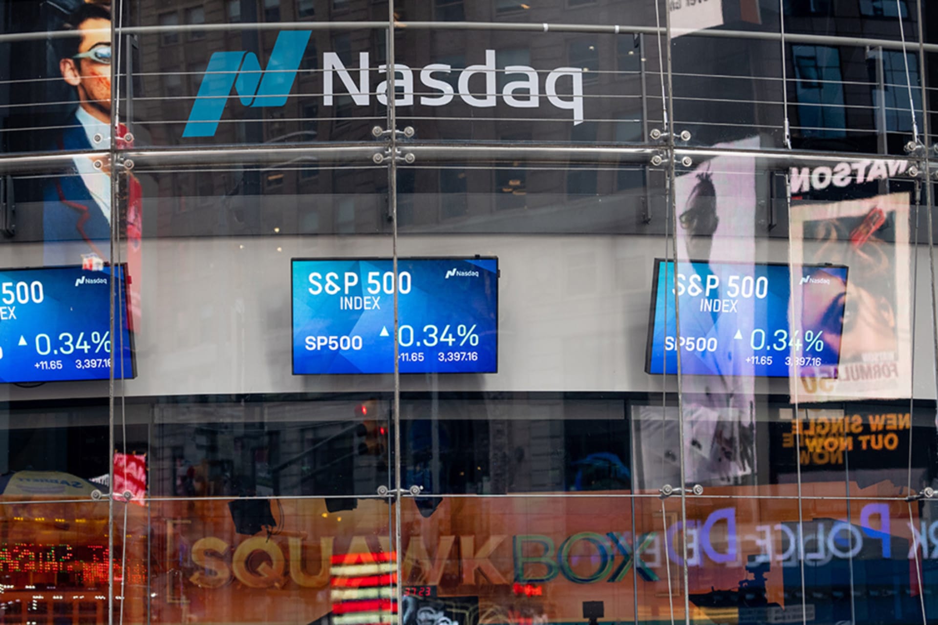 <p>S&P 500 trading screens are displayed at the Nasdaq building in Times Square as the city continues Phase 4 of re-opening following restrictions imposed to slow the spread of coronavirus in New York City. </p>
