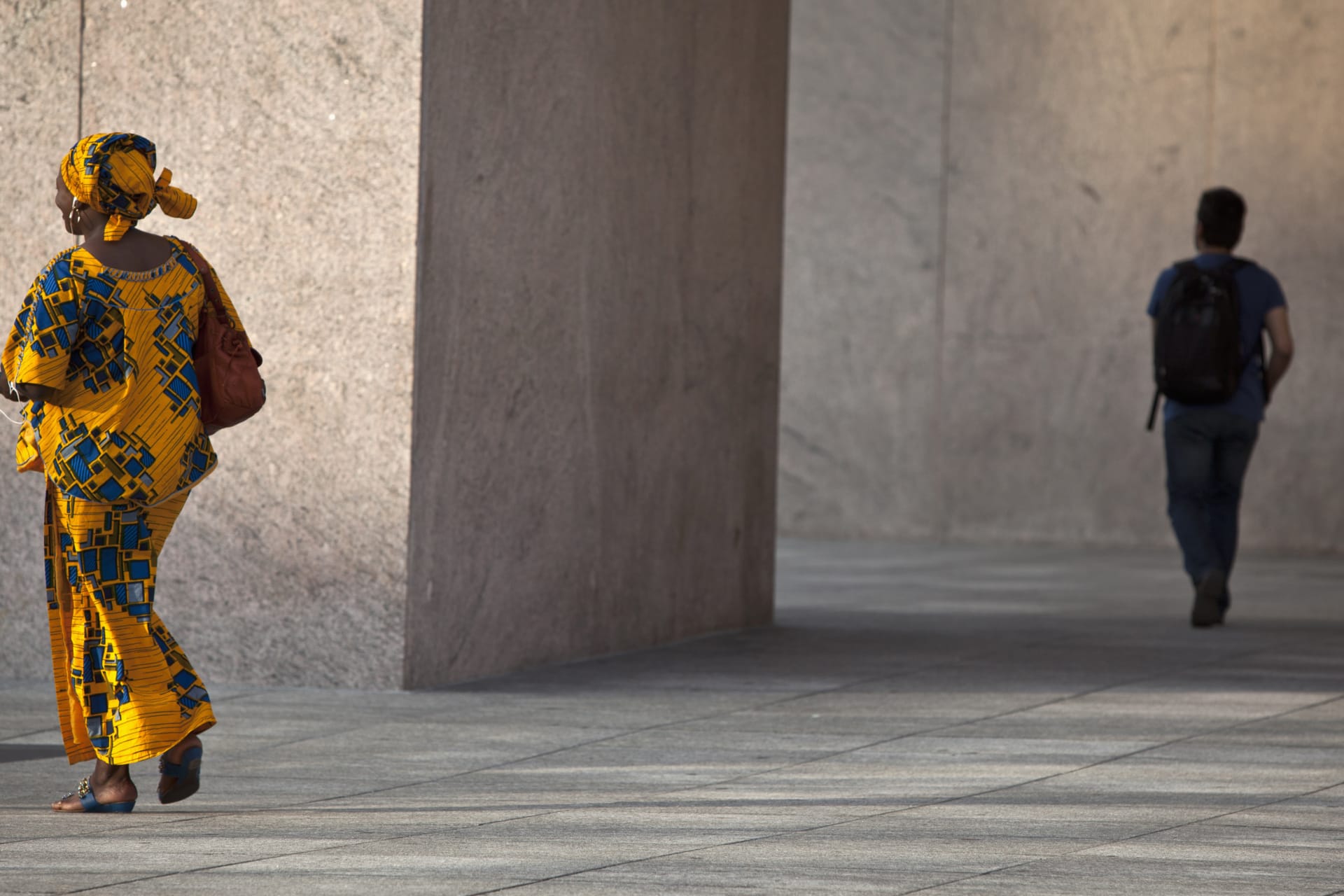 <p>People walk though African Square in the Harlem neighborhood of New York, on August 30, 2013.</p>
