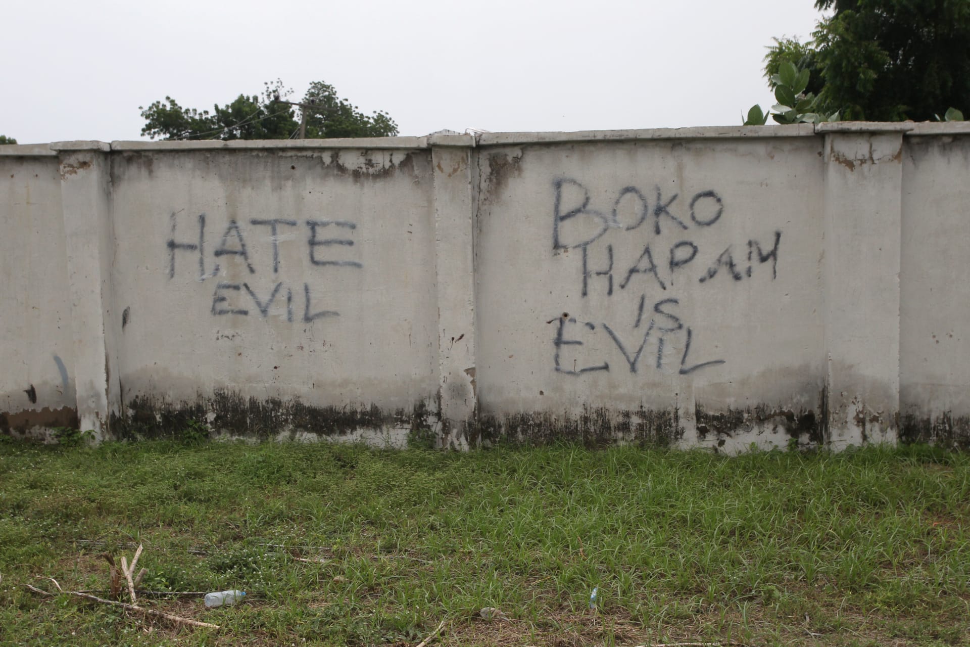 <p>Writings describing Boko Haram are seen on the wall along a street in Bama, in Borno, Nigeria, on August 31, 2016.</p>
