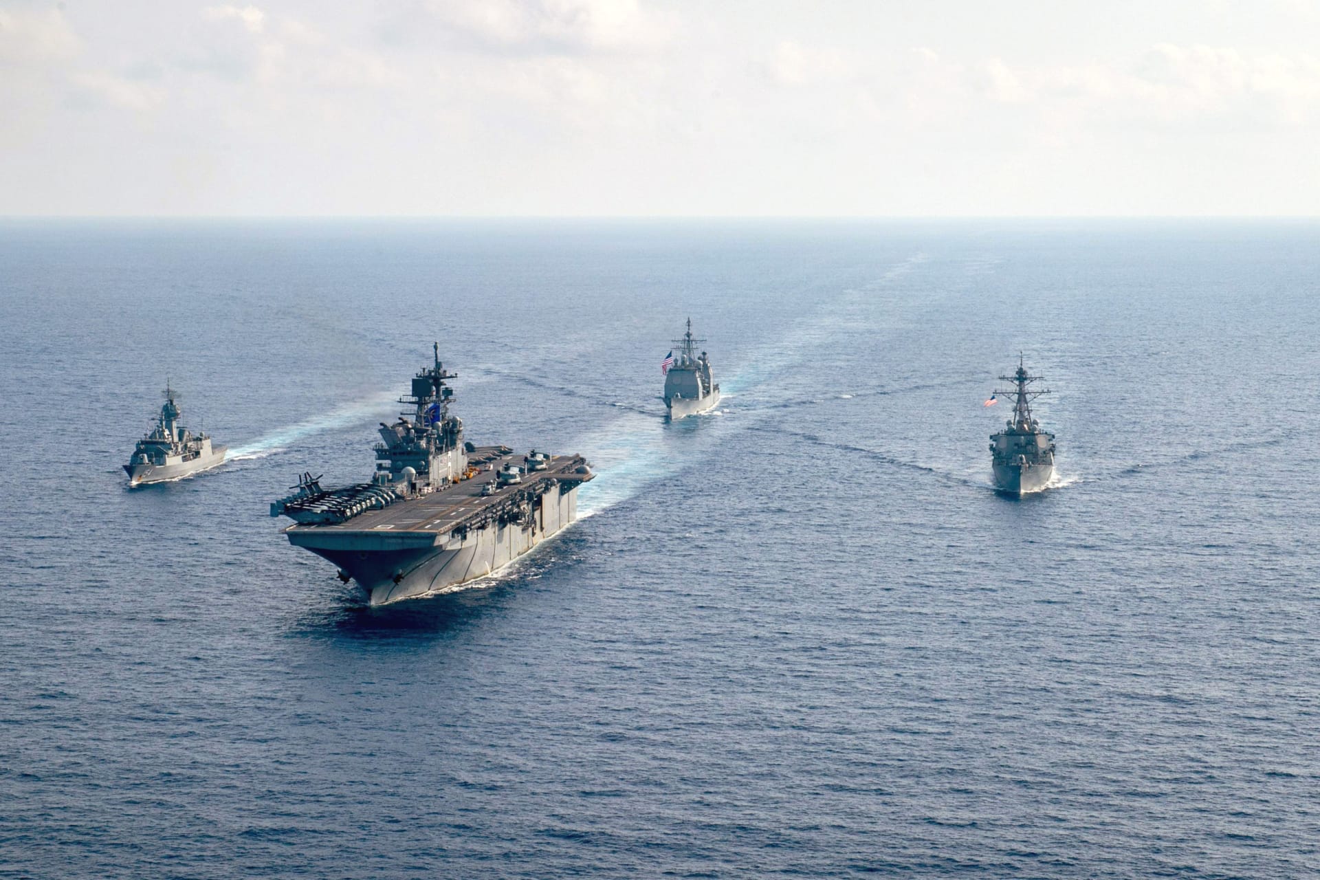 <p>The Royal Australian Navy HMAS Parramatta (L) is underway with the U.S. Navy USS America, the USS Bunker Hill, and the USS Barry in the South China Sea on April 18, 2020. </p>
