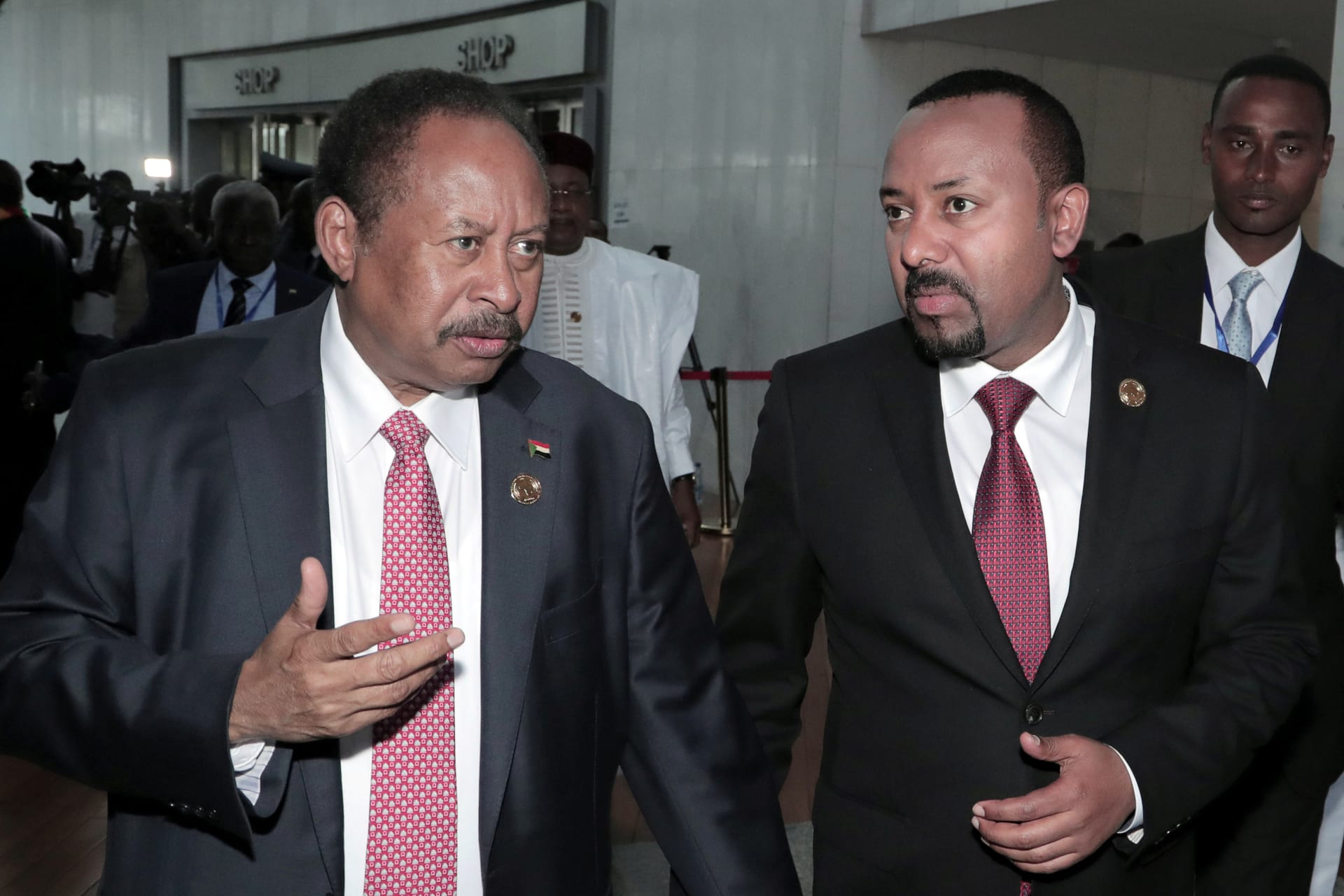 <p>Sudan’s Prime Minister Abdalla Hamdok and Ethiopia’s Prime Minister Abiy Ahmed arrive for the opening of the 33rd Ordinary Session of the Assembly of the Heads of State and the Government of the African Union in Addis Ababa, Ethiopia, February 9, 2020</p>
