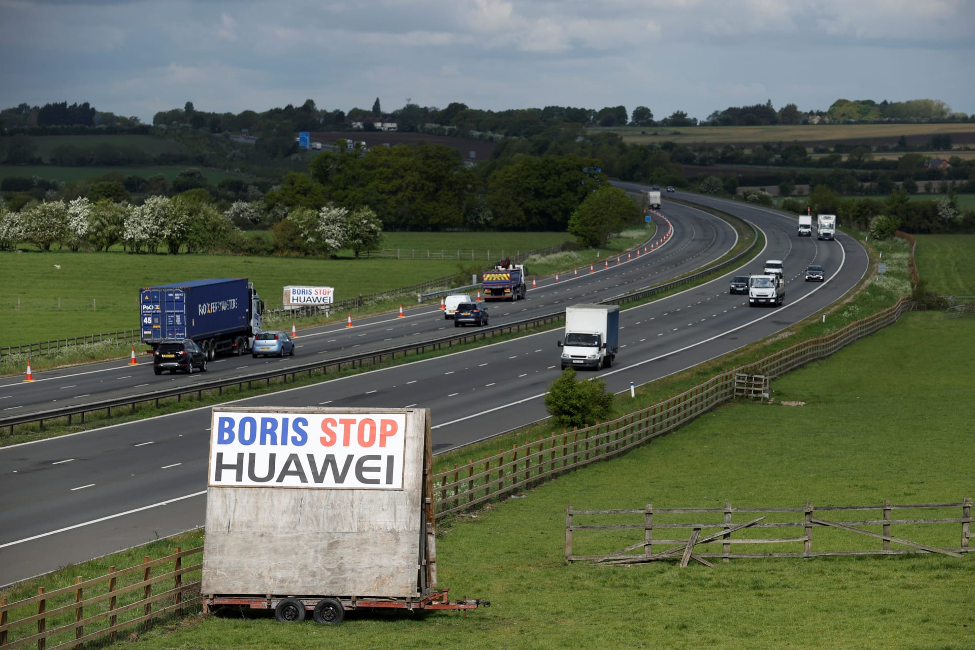 <p>A sign reading “Boris Stop Huawei” is seen next to the M40 motorway.</p>
