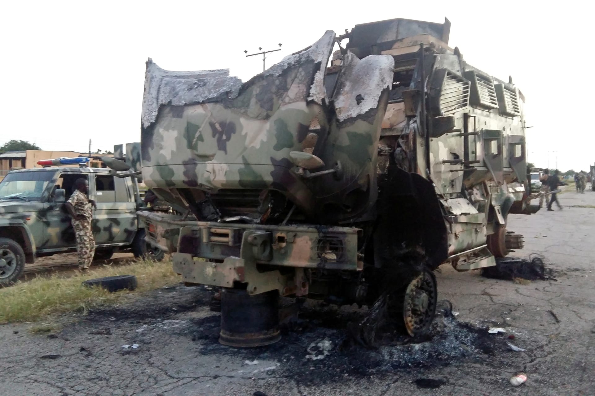 <p>A damaged military vehicle is pictured in the northeast town of Gudumbali, after an attack by members of Islamic State in West Africa (ISWA), Nigeria September 11, 2018.</p>
