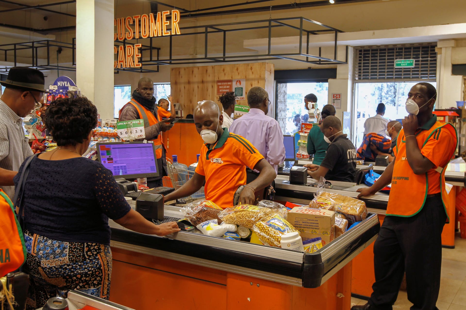 <p>Customers shop for essential commodities inside the Naivas supermarket as residents stock their homes amid concerns about the spread of coronavirus disease (COVID-19) in Nairobi, Kenya March 23, 2020.</p>
