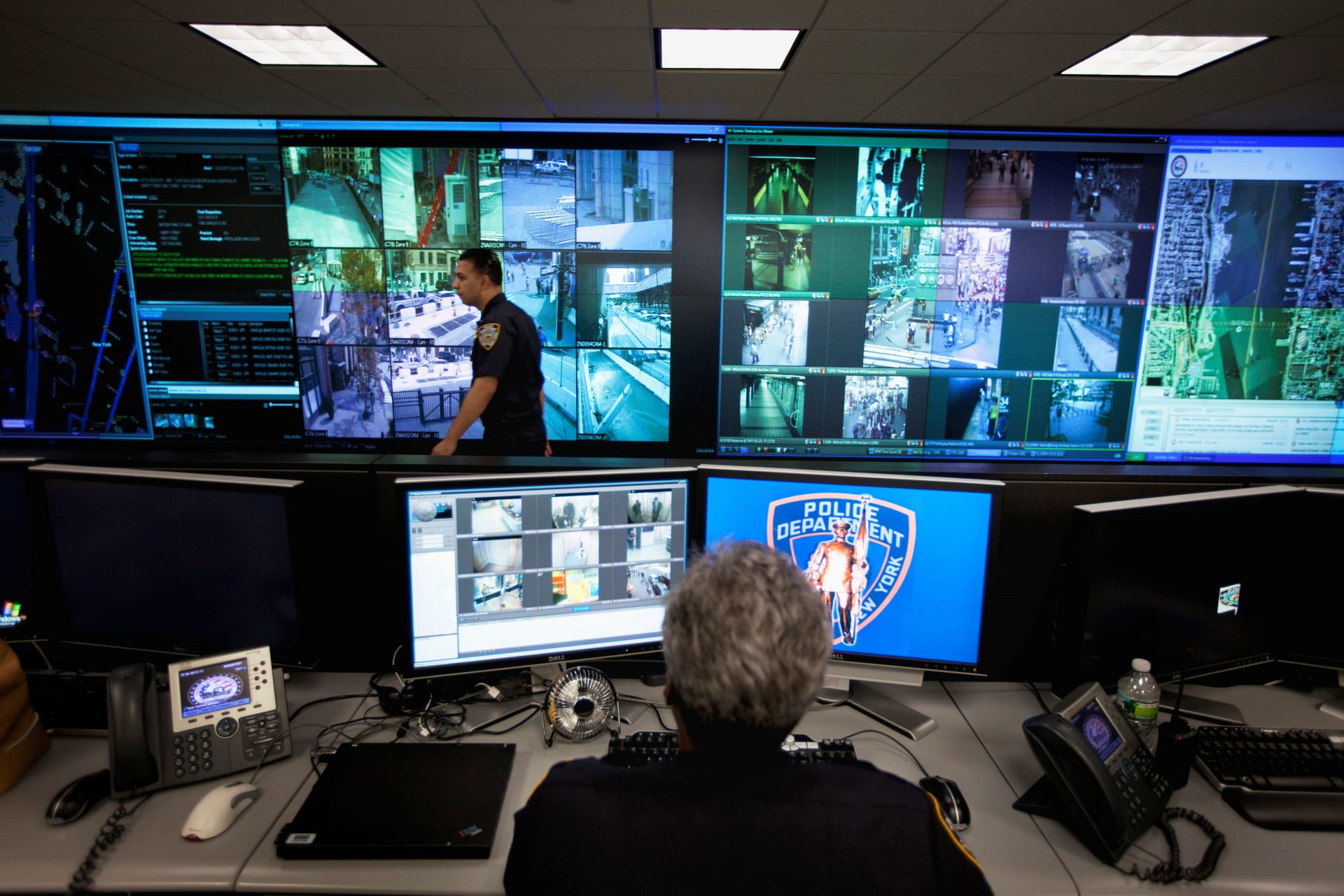 <p>A New York Police Department officer watches video feeds in the Lower Manhattan Security Initiative facility in New York September 1, 2011.</p>
