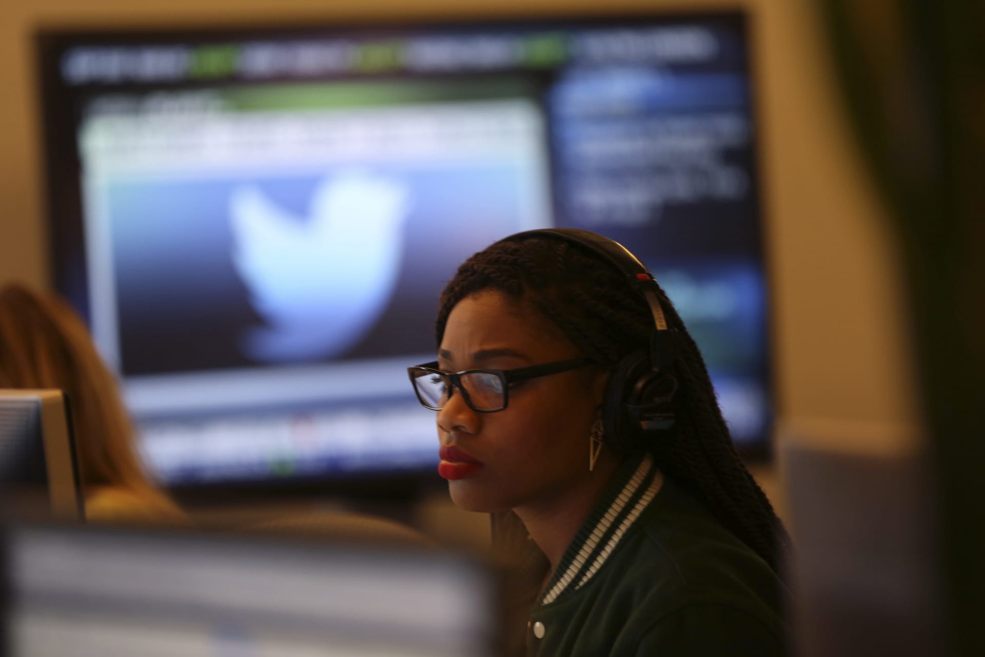 <p>A Twitter employee works at a computer at the company’s headquarters.</p>
