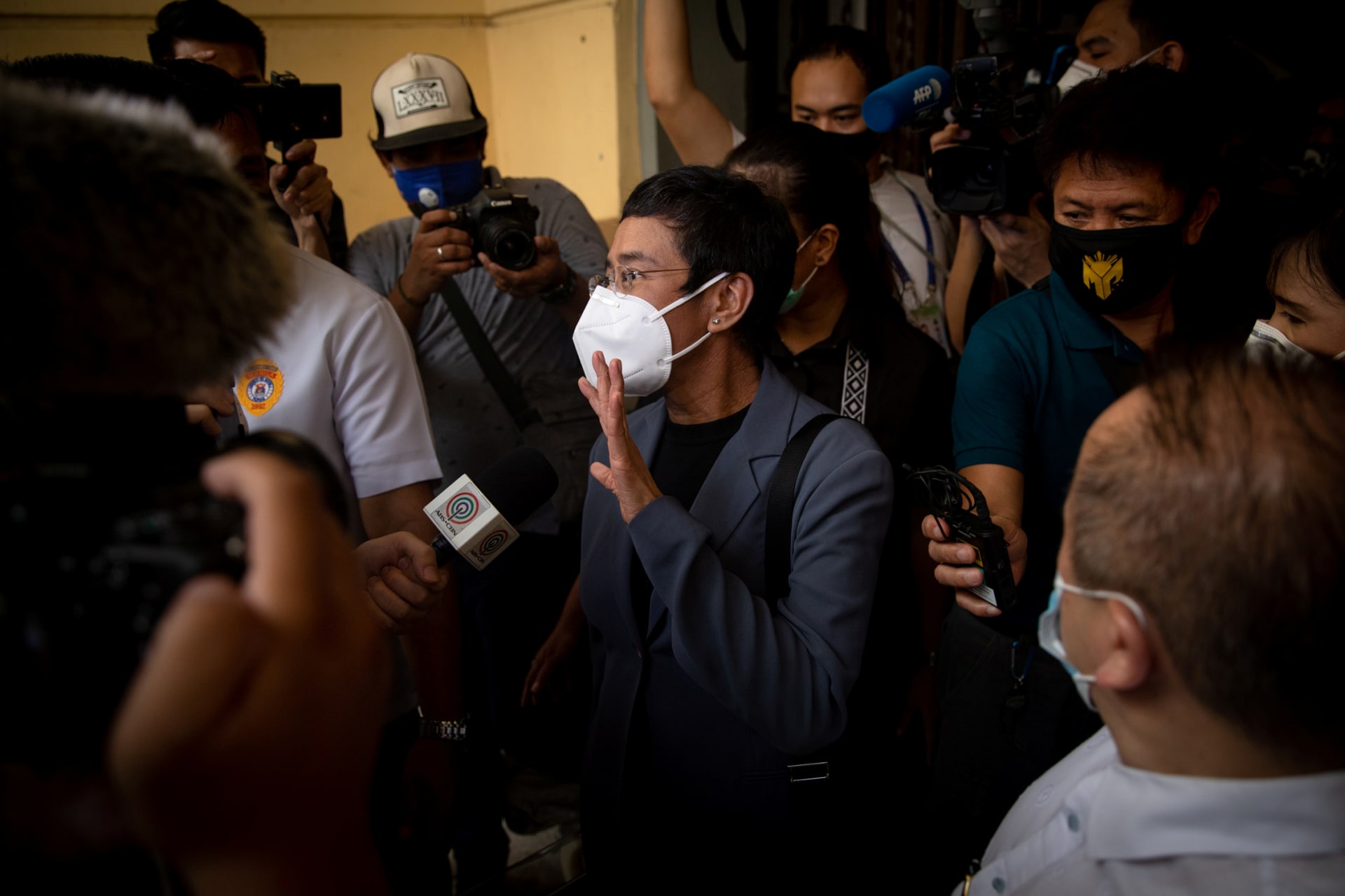 <p>Maria Ressa walks out of Manila City Hall after being found guilty of cyber libel.</p>
