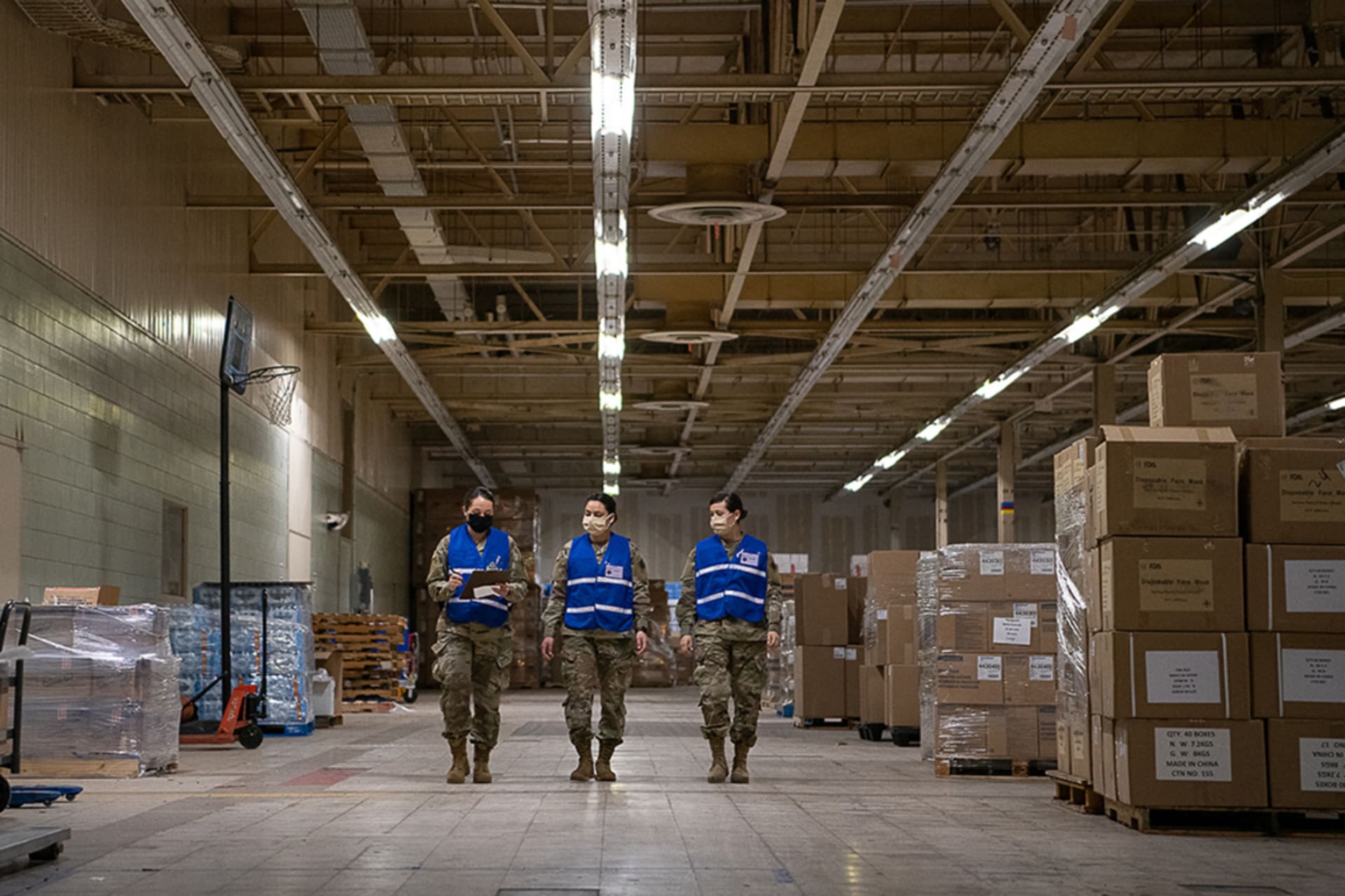 <p>Members of the Oklahoma National Guard walk in the Strategic National Stockpile Warehouse.</p>
