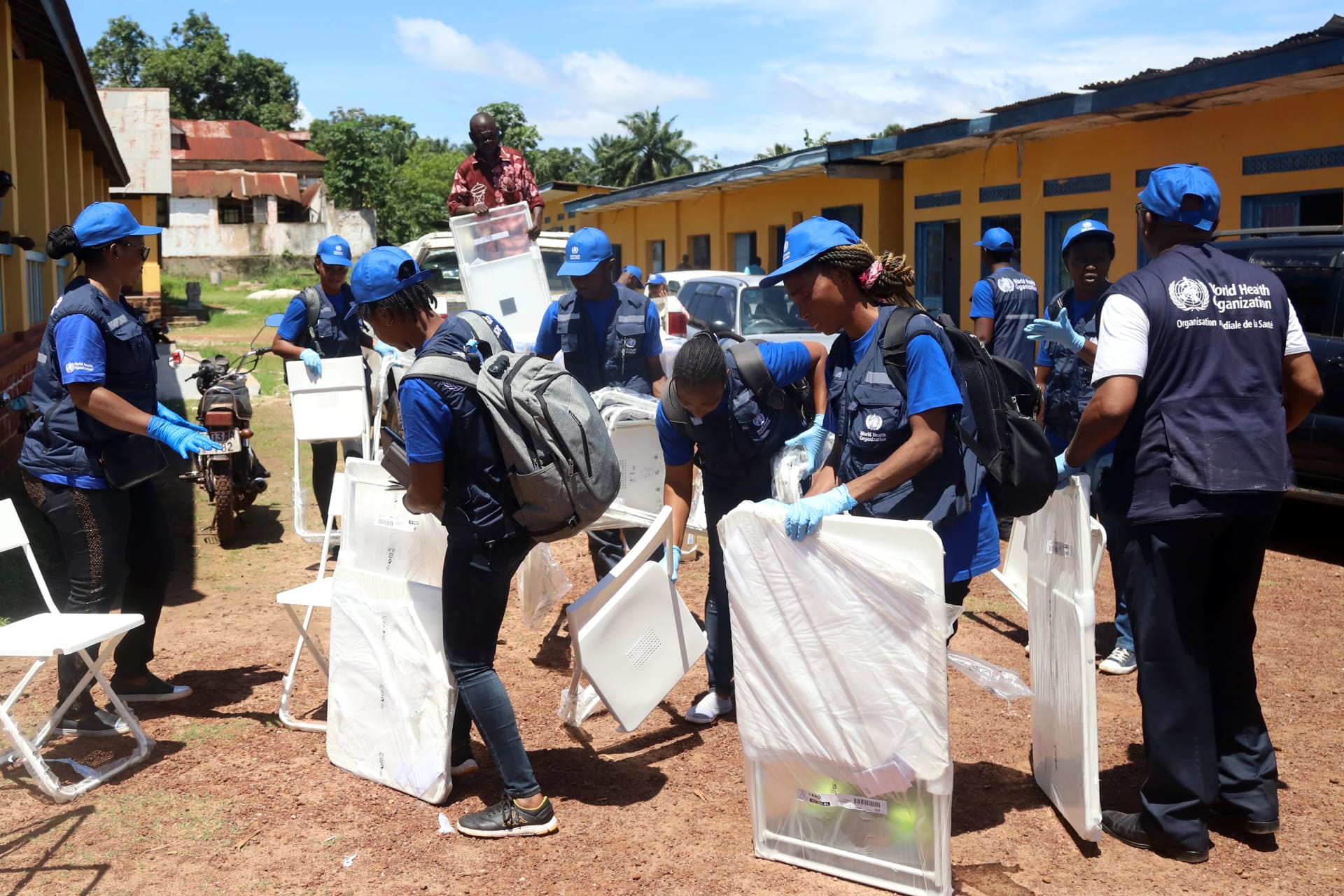 <p>World Health Organization workers, during a 2018 Ebola outbreak, prepare a center for vaccination in the port city of Mbandaka, Democratic Republic of Congo, on May 21, 2018.</p>
