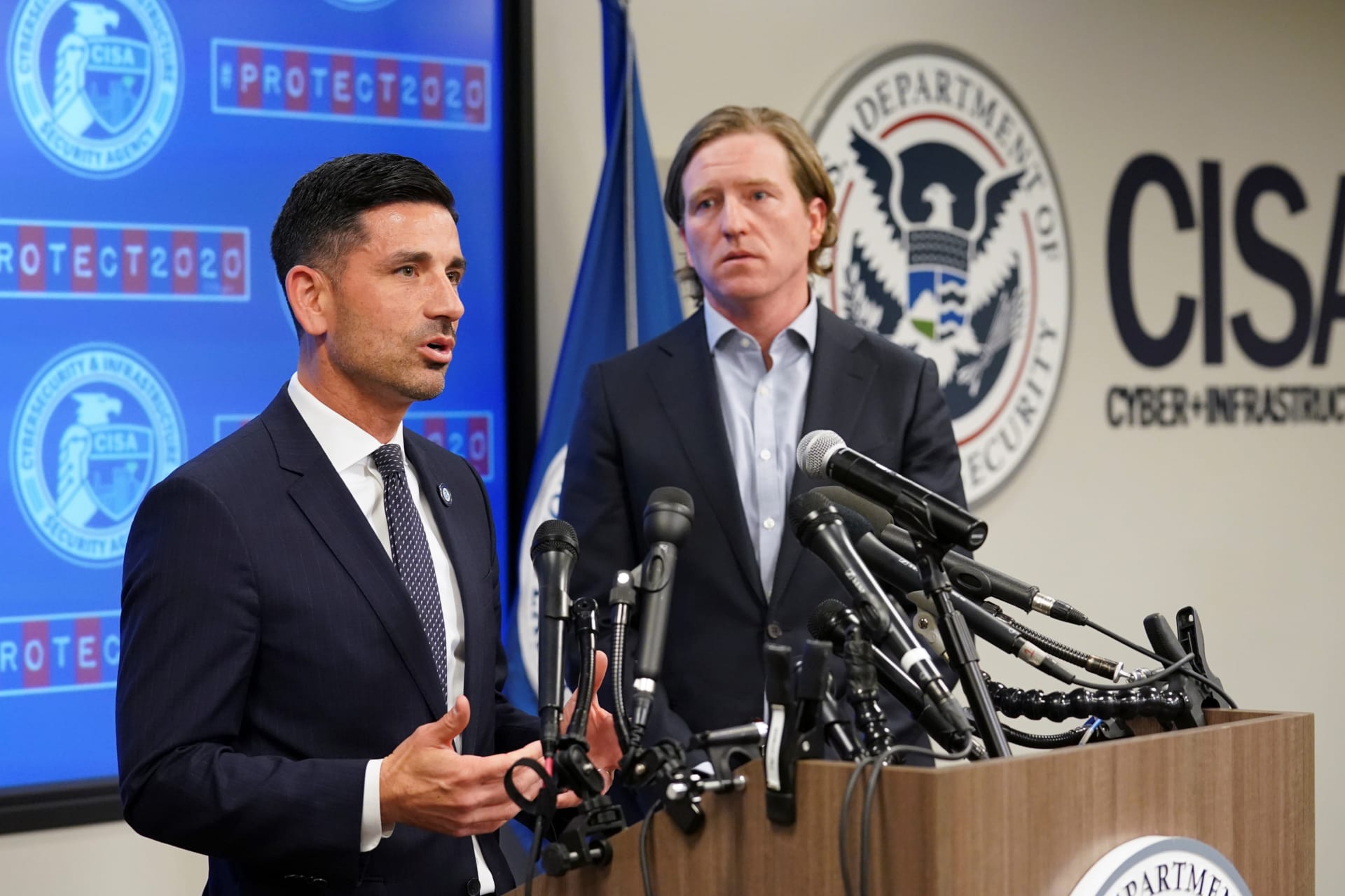 <p>Department of Homeland Security (DHS) Acting Secretary Chad Wolf (L) and Cybersecurity and Infrastructure Security Agency (CISA) Director Christopher Krebs speak to reporters.</p>
