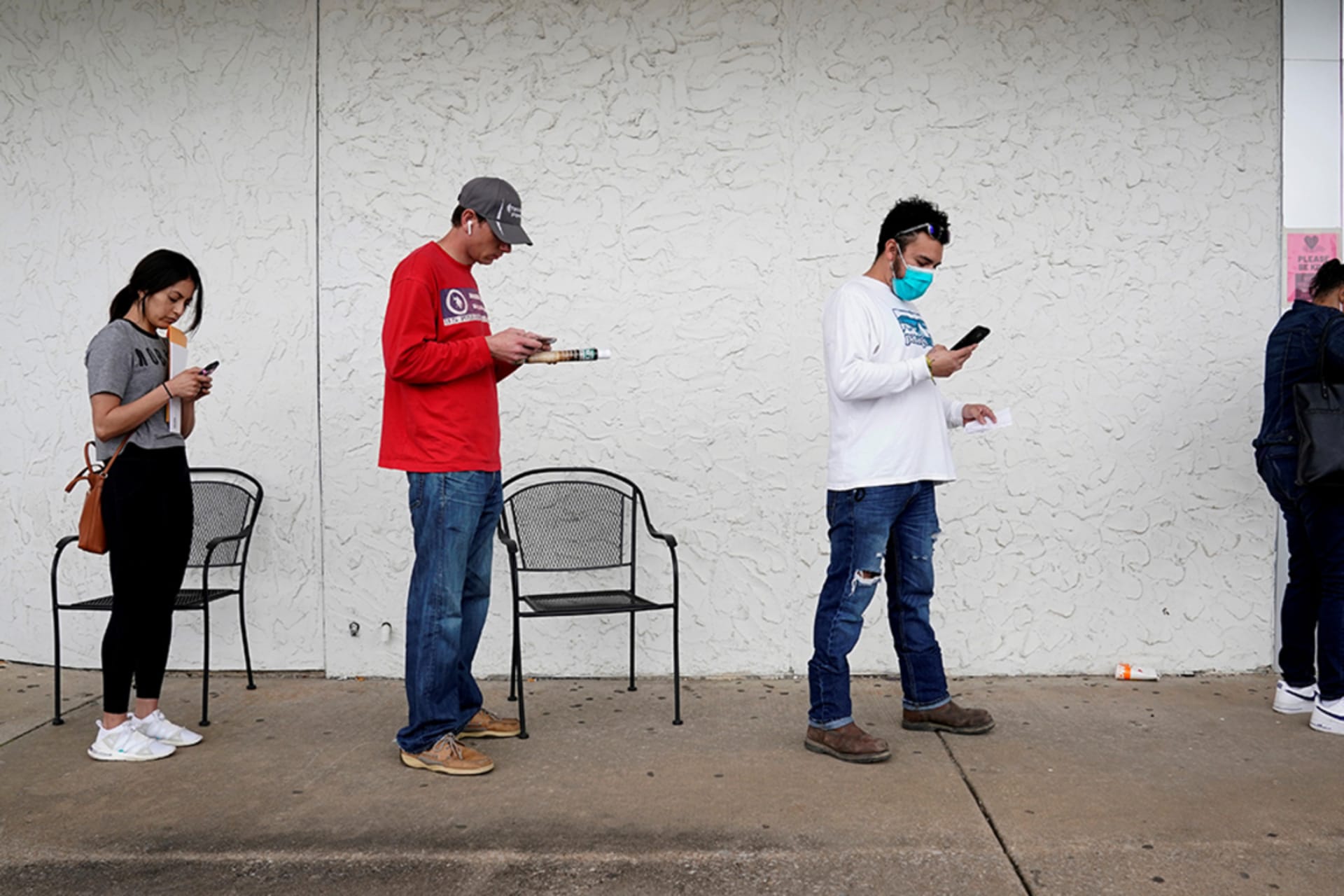 <p> People in Arkansas wait in line to file for unemployment after the COVID-19 outbreak.</p>
