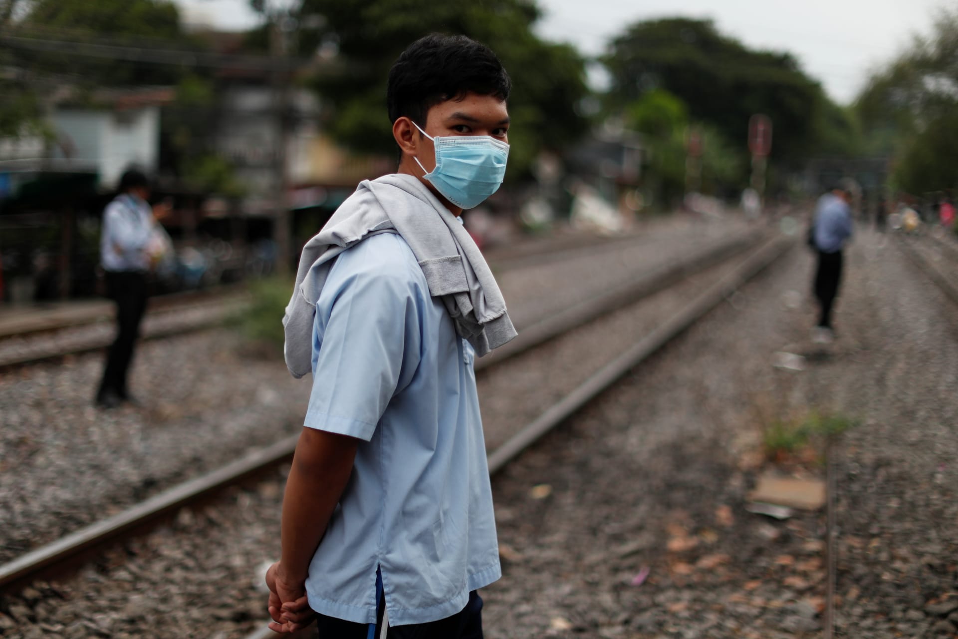 <p>A boy wearing a protective mask waits for a train in Bangkok, Thailand, on April 27, 2020.</p>
