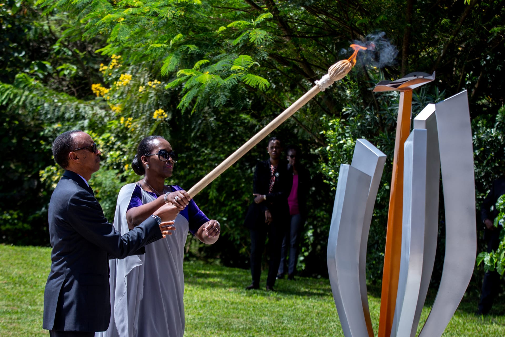 <p>President Paul Kagame and First Lady Jeanette Kagame light the Rwandan genocide flame of hope, known as the “Kwibuka” (Remembering), to commemorate the 1994 Genocide at the Kigali Genocide Memorial Center in Kigali, Rwanda, on April 7, 2020. </p>
