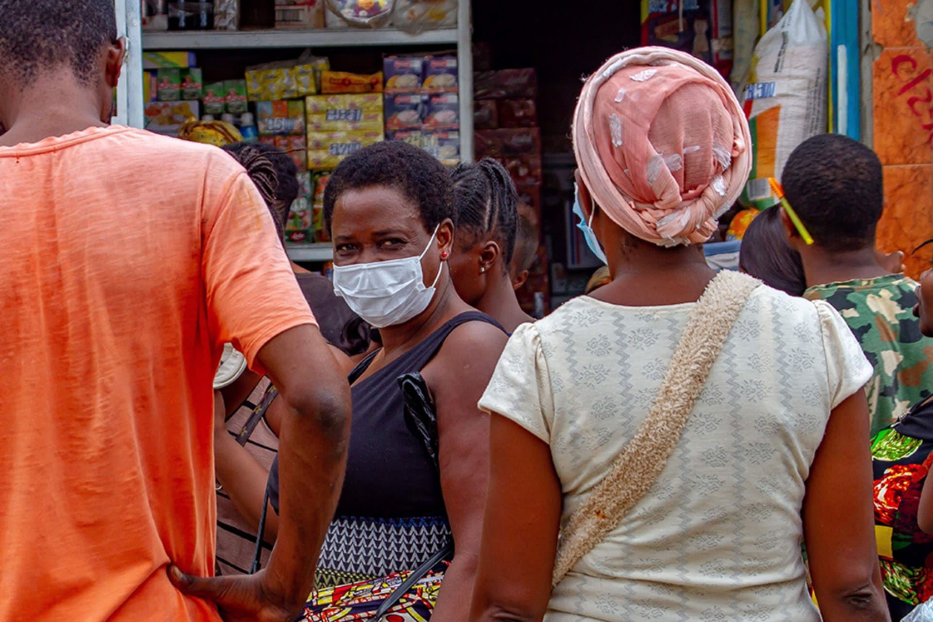 <p>A food vendor wears a mask in Luanda, Angola, where severe restrictions have been implemented to help stop the spread of COVID-19.</p>
