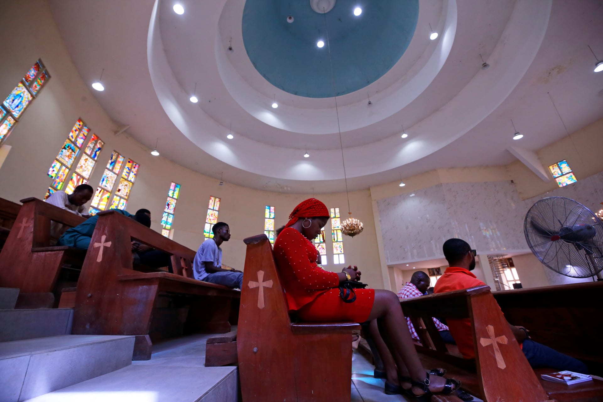 <p>Christian worshippers sit during a mass at the St. Gabriel Catholic church, as the government struggles to control the spread of the coronavirus disease (COVID-19) in Abuja, Nigeria, on March 22, 2020. Lockdown orders were issued for March 30.</p>

