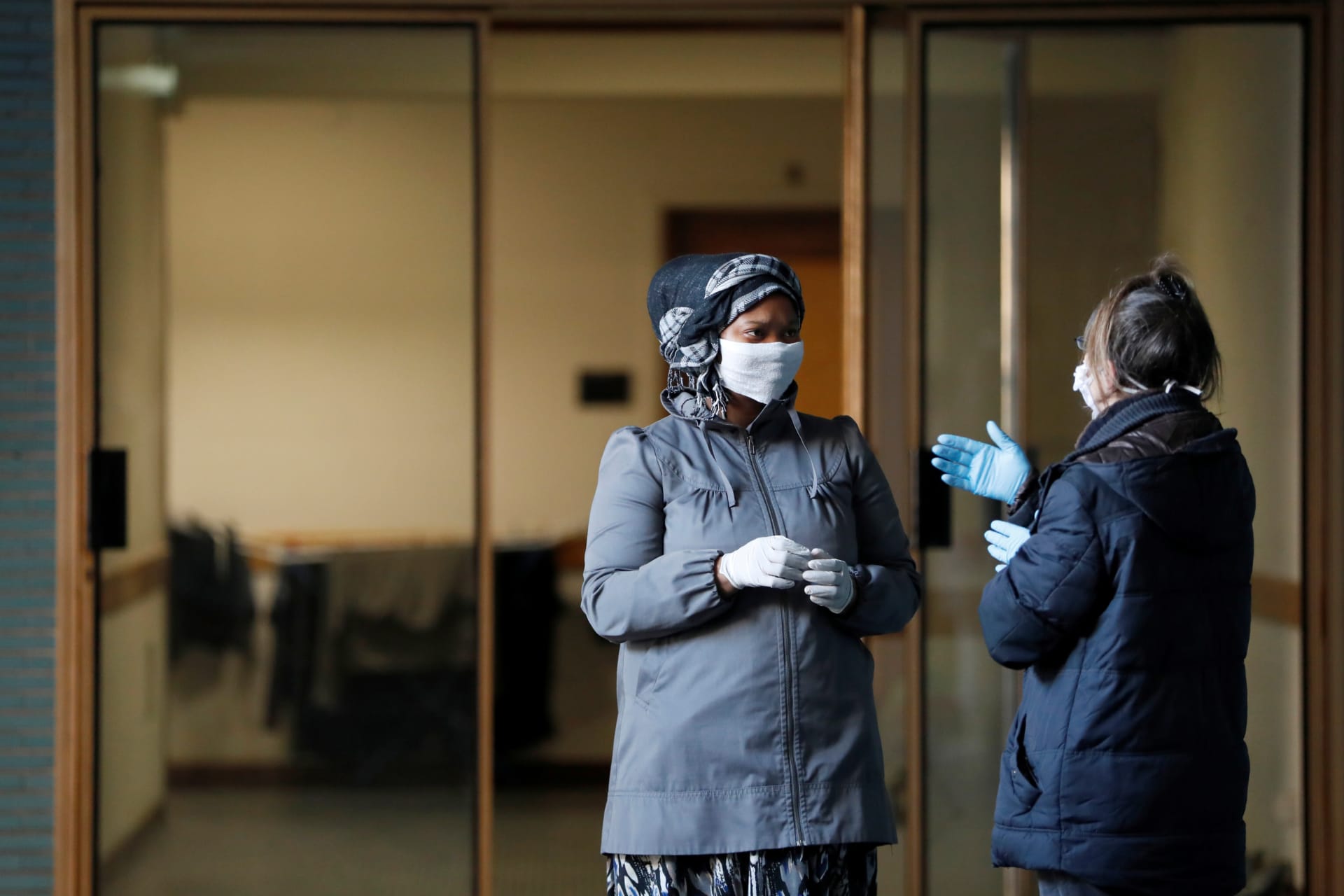 <p>Women speak while they wait to be checked by a medical team as the spread of coronavirus disease (COVID-19) continues, in Rome, Italy, April 3, 2020. </p>
