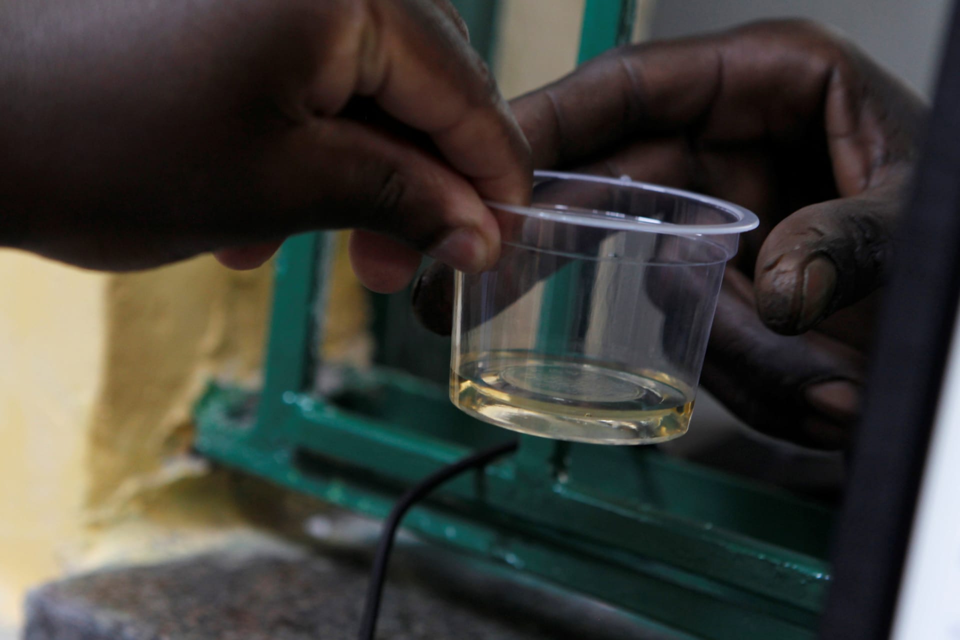 <p>A recovering drug addict receives his dose of methadone at a Medication Assisted Therapy clinic run by Doctors Without Borders (MSF) at Karuri Level 4 hospital in Kiambu, Kenya, on October 3, 2019.</p>
