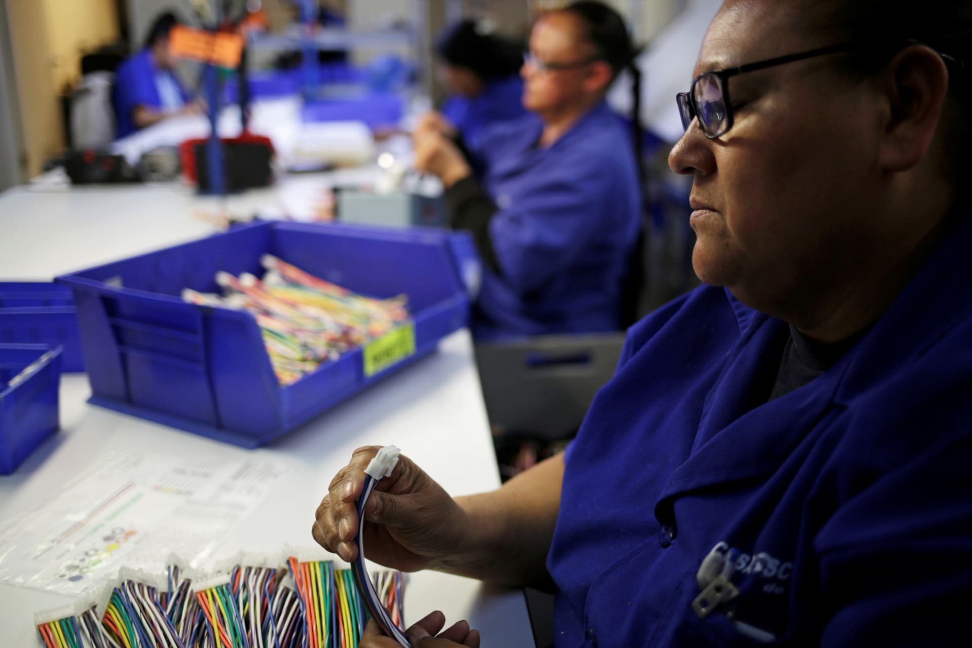 <p>Operators work at a wire harness and cable manufacturing plant as the fast-spreading coronavirus outbreak has rippled through the global economy and upended supply chains, in Ciudad Juarez, Mexico March 11, 2020. </p>
