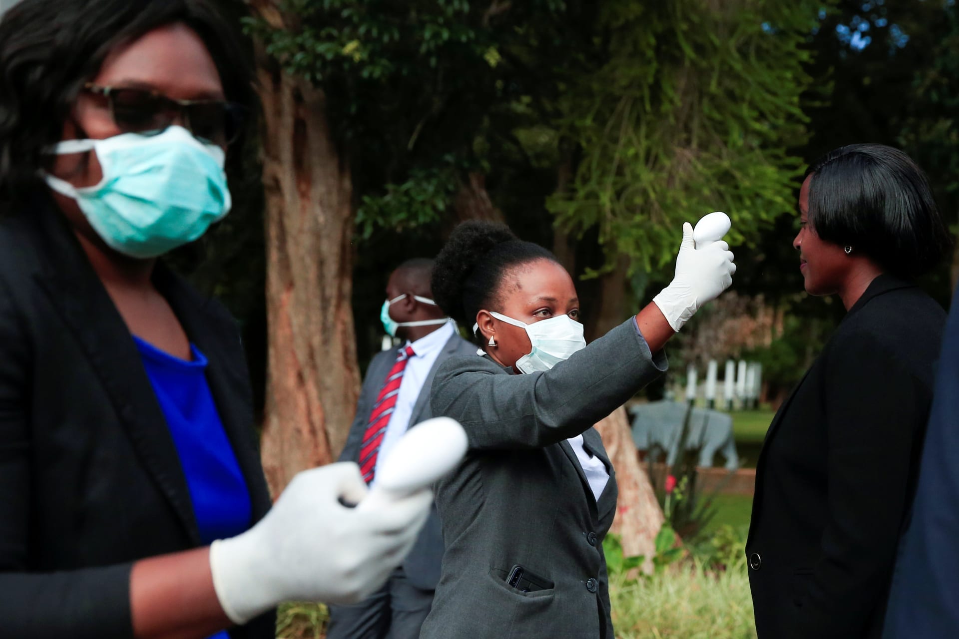 <p>Health workers screen visitors to prevent the spread of COVID-19 at State House in Harare, Zimbabwe, March 19, 2020</p>
