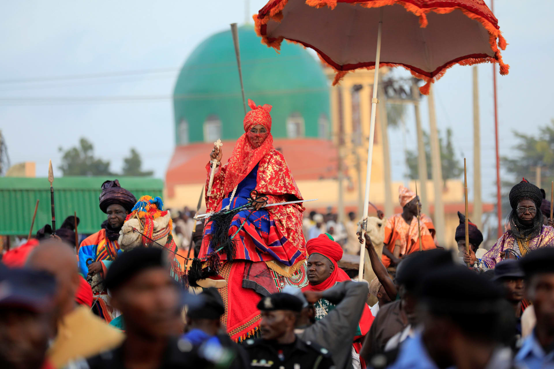 <p>Muhammad Lamido Sanusi II, then the emir of Kano, rides on a dressed camel during the Durbar festival, on the second day of Eid al-Adha celebration in Nigeria’s northern city of Kano, on September 2, 2017.</p>
