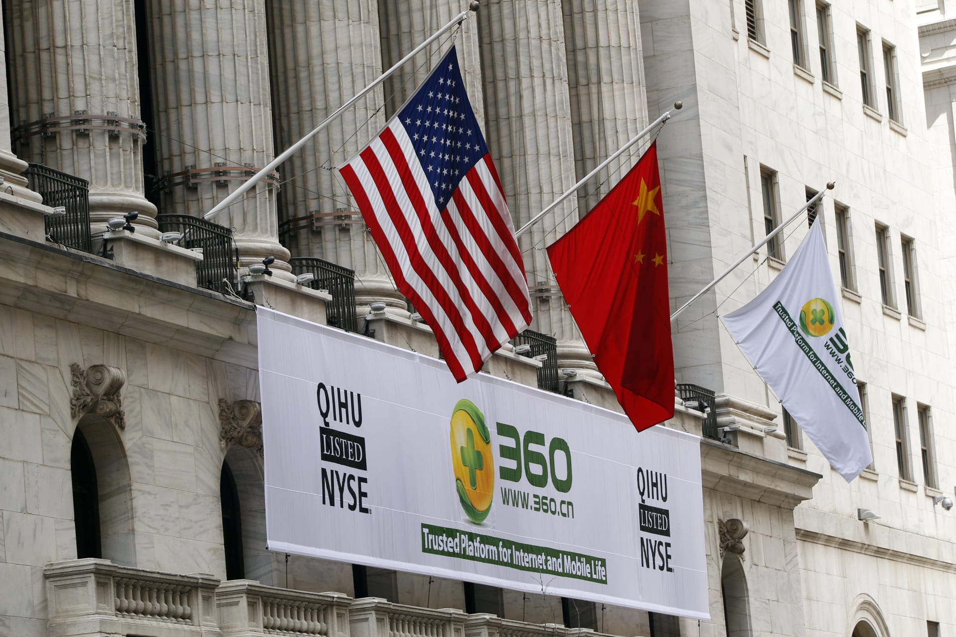 <p>A sign advertising the Qihoo 360 Technology Co Ltd is hung with the U.S. and Chinese flags outside of the New York Stock Exchange before the company’s Initial Public Offering (IPO).</p>
